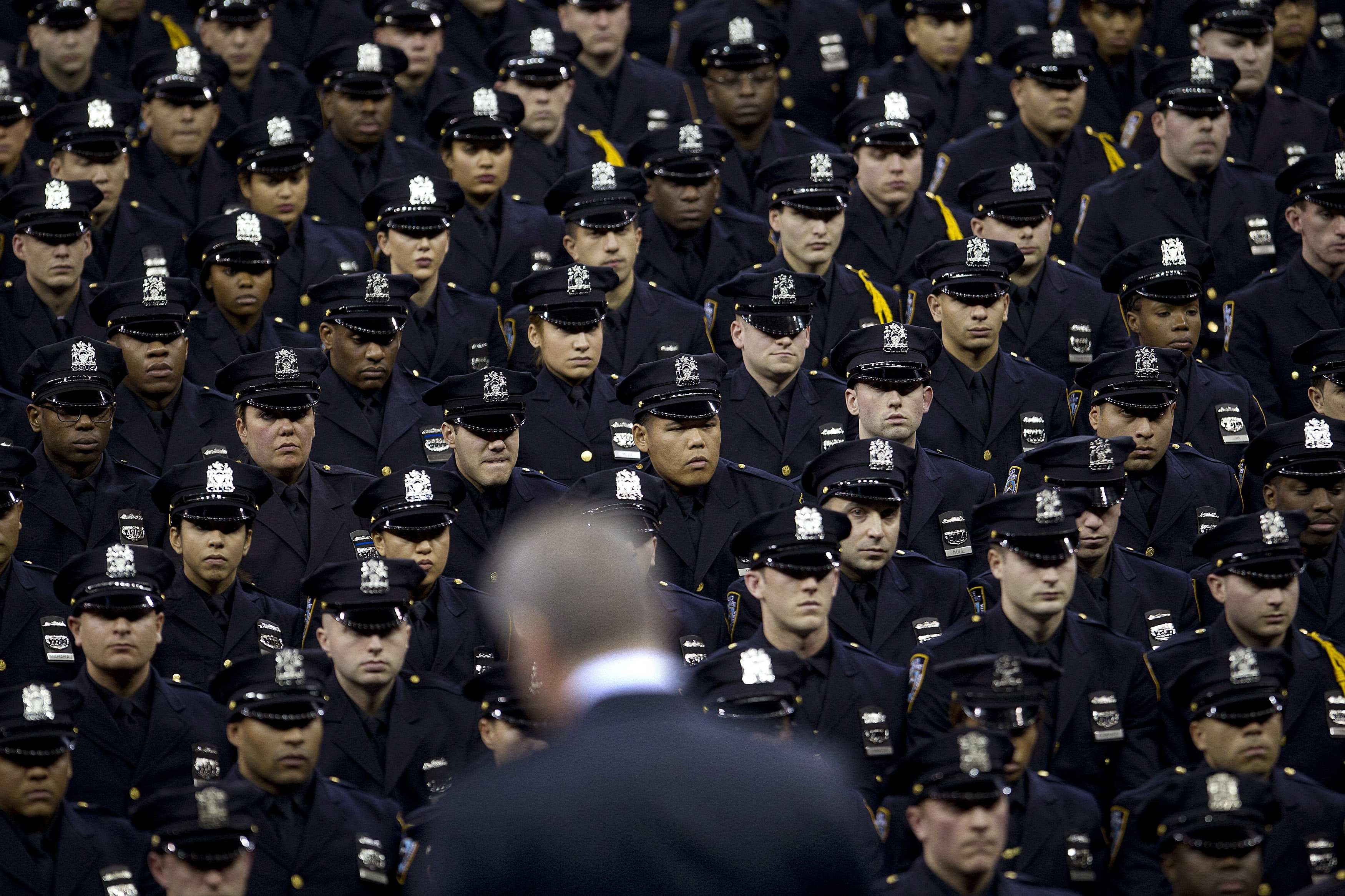 New York Mayor Bill de Blasio speaks from the podium to the New York City Police Academy Graduating class in New Yorkon Dec. 29, 2014. (Carlo Allegri—Reuters)