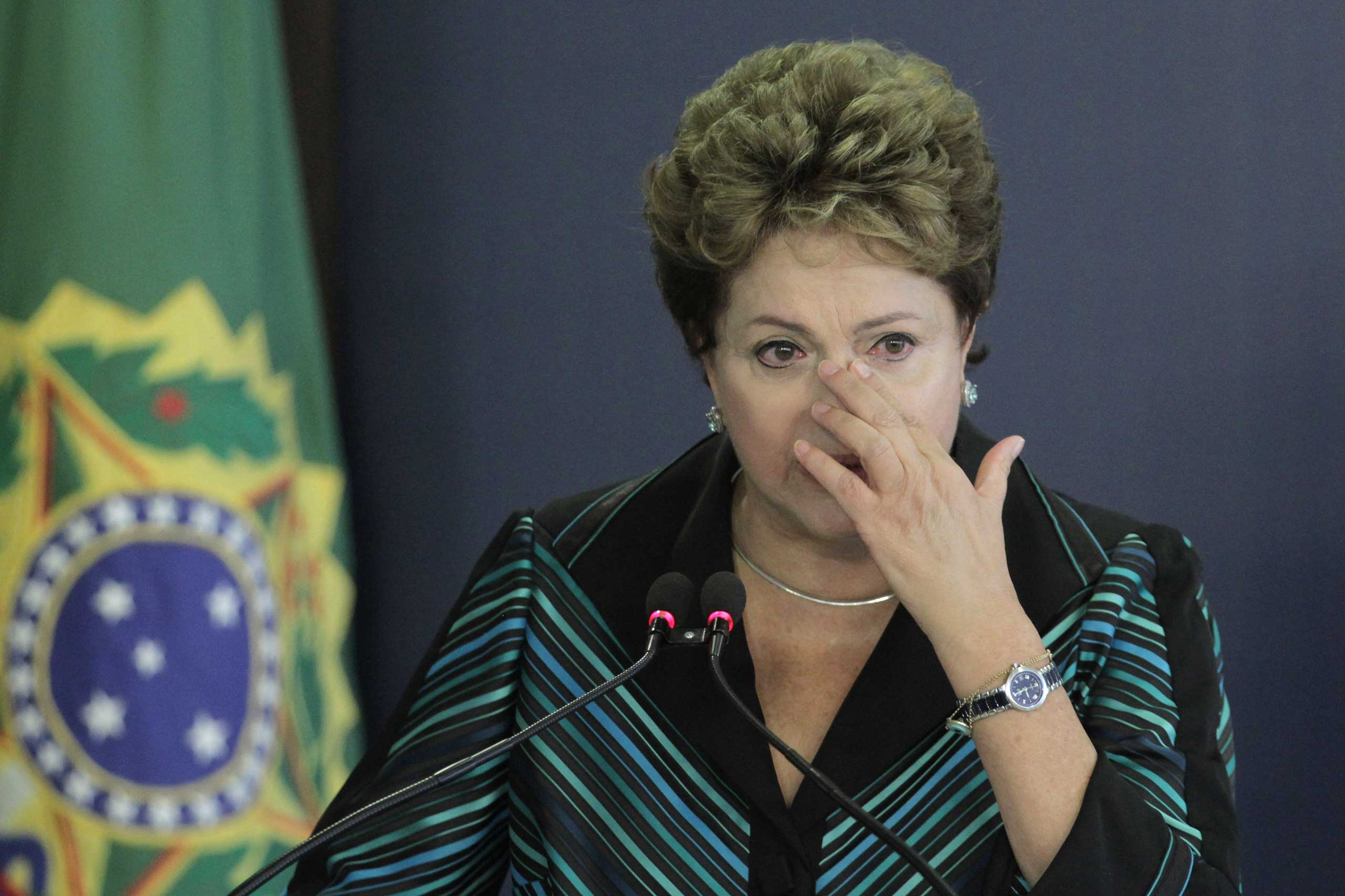 Brazil's President Dilma Rousseff cries during a speech at the launching ceremony of the National Truth Commission Report, at the Planalto Presidential Palace, in Brasilia, Brazil, Dec. 10, 2014. (Eraldo Peres—AP)