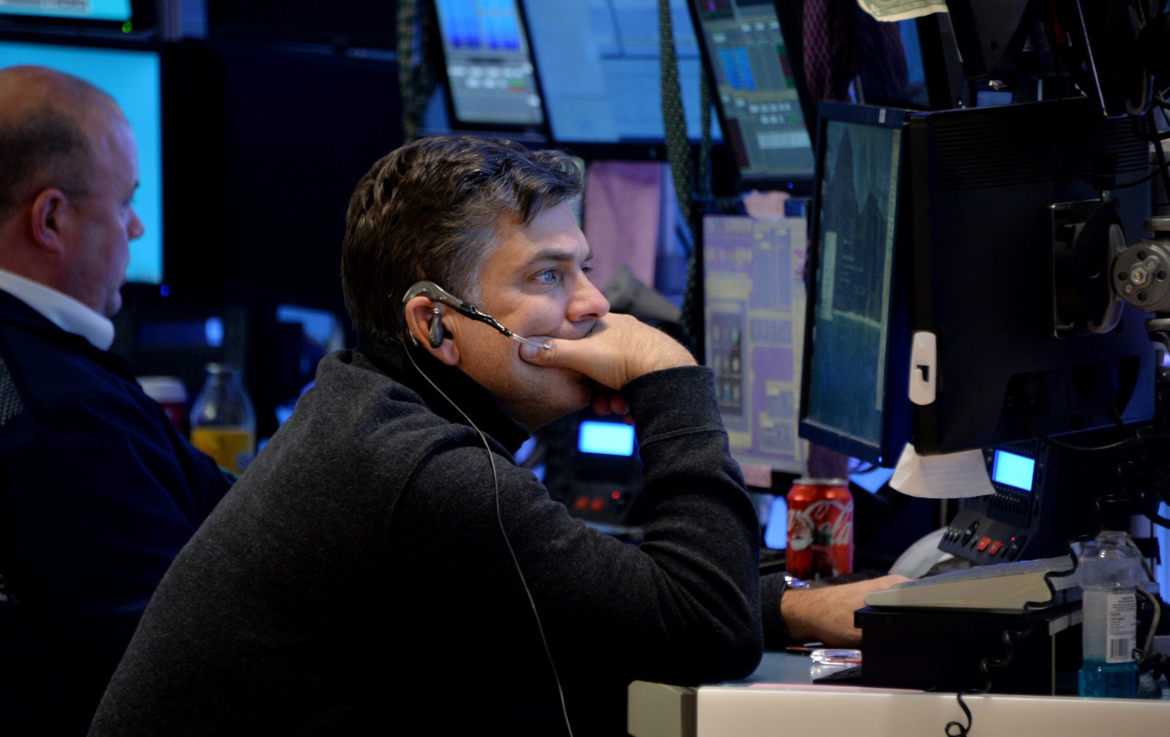 A trader works on the floor of the New York Stock Exchange at the end of the trading day in New York on Dec. 12, 2014.