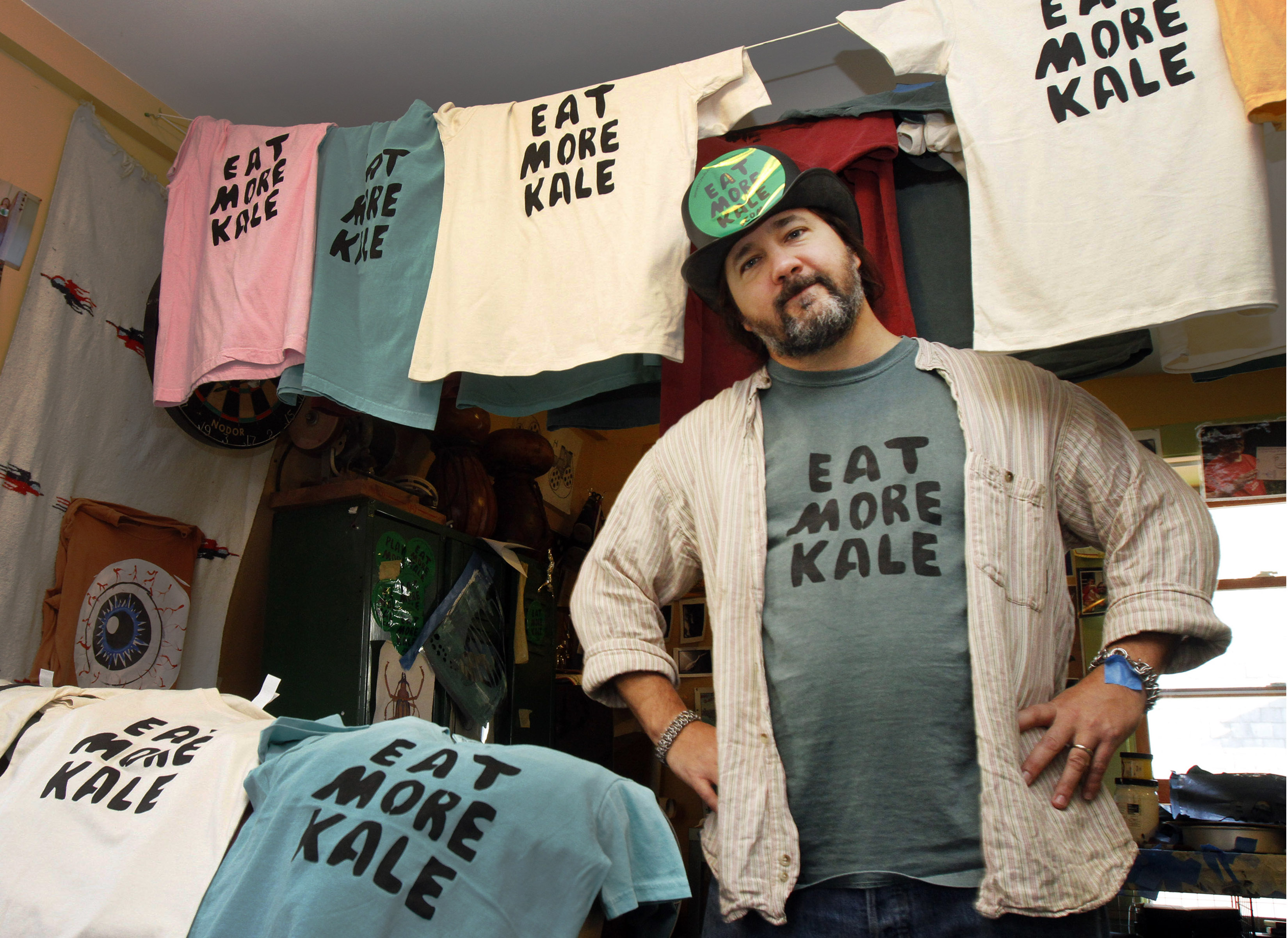 Bo Muller-Moore stands in his home studio in Montpelier, Vt. Muller-Moore, the Vermont man who is building a business around the term "eat more kale," which has been plastered on T-shirts, bumper stickers and other items, is running into opposition from the second largest fried chicken retailer in the country, Chick-fil-A, on Nov. 22, 2011. (Toby Talbot—AP)