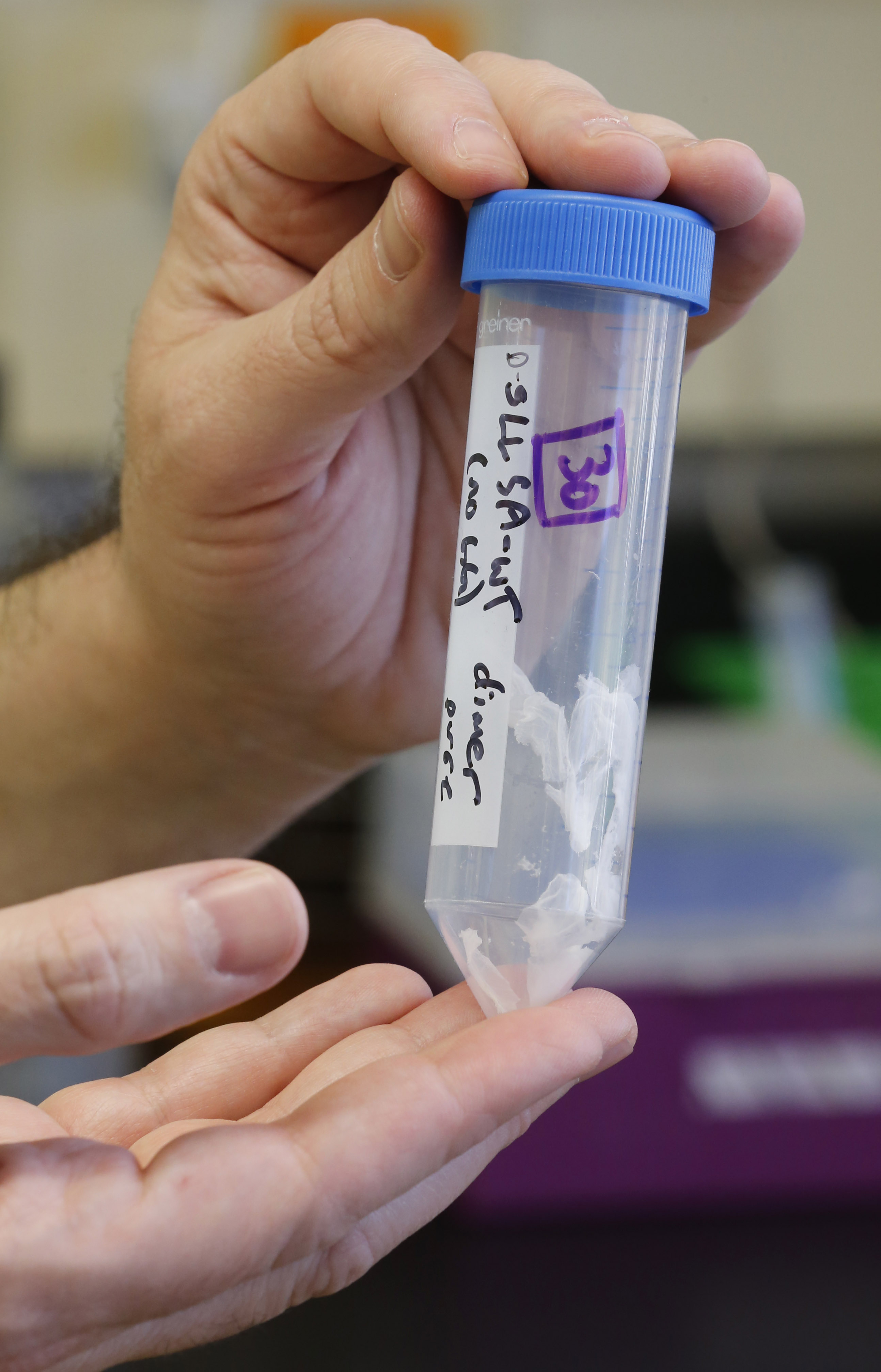 A container holds a Peptide that contains a potential new drug candidates for testing against a part of Ebola that is vulnerable to drugs, at the University of Utah on Oct. 14, 2014 in Salt Lake City. (George Frey—Getty Images)