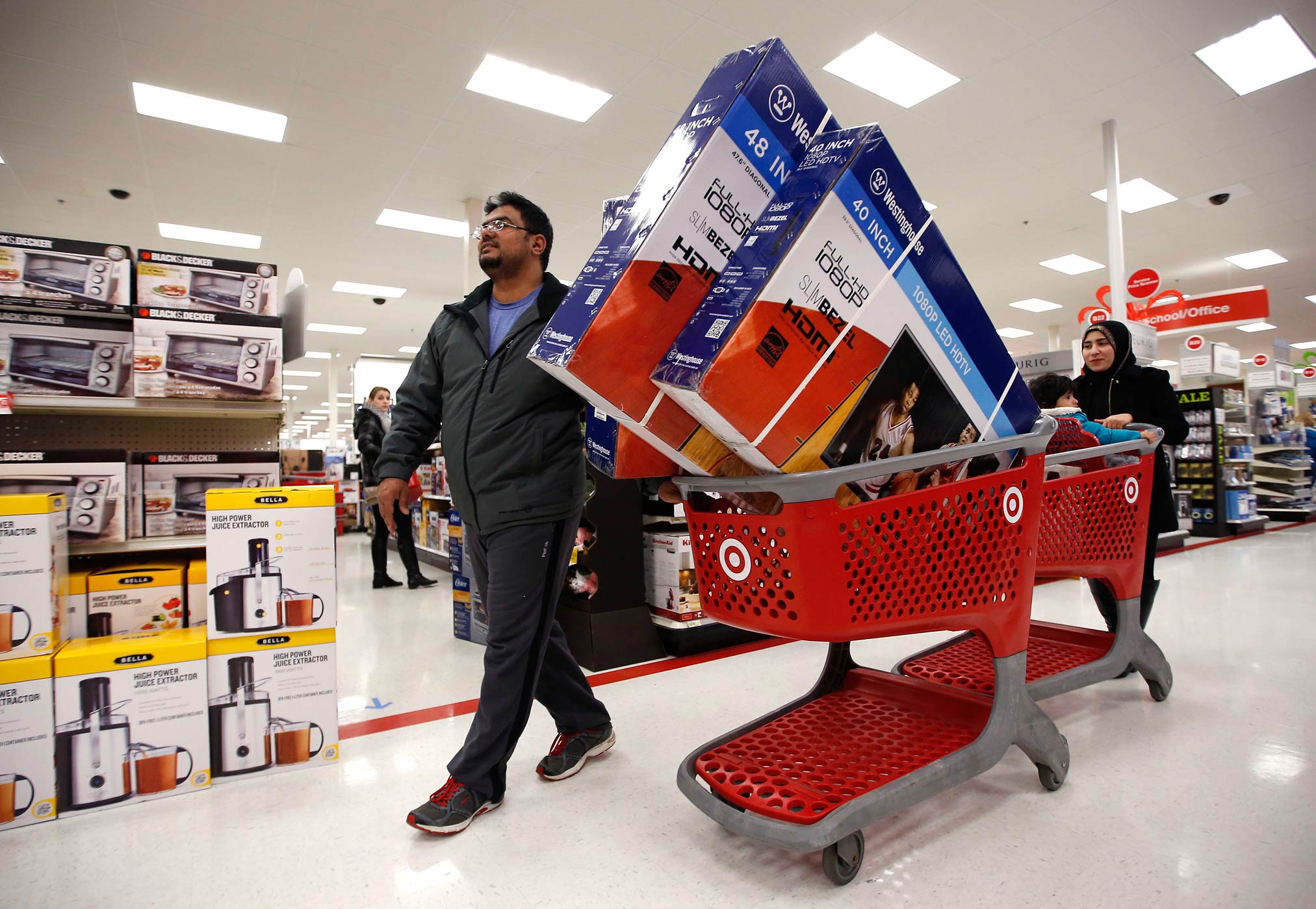 Shoppers patronize a Target store just after midnight on Black Friday, Nov. 28, 2014, in South Portland, Maine. (Robert F. Bukaty—AP)