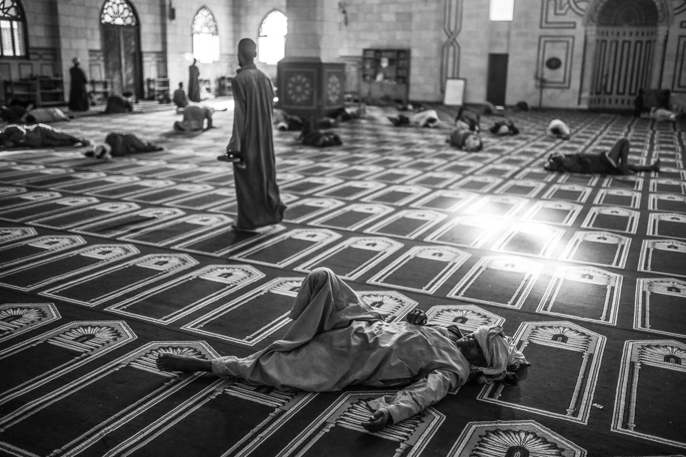 Sufi Muslims take a rest at Abul-Hassan Al-Shazly mosque during the early hours of the morning. Oct. 1, 2014.