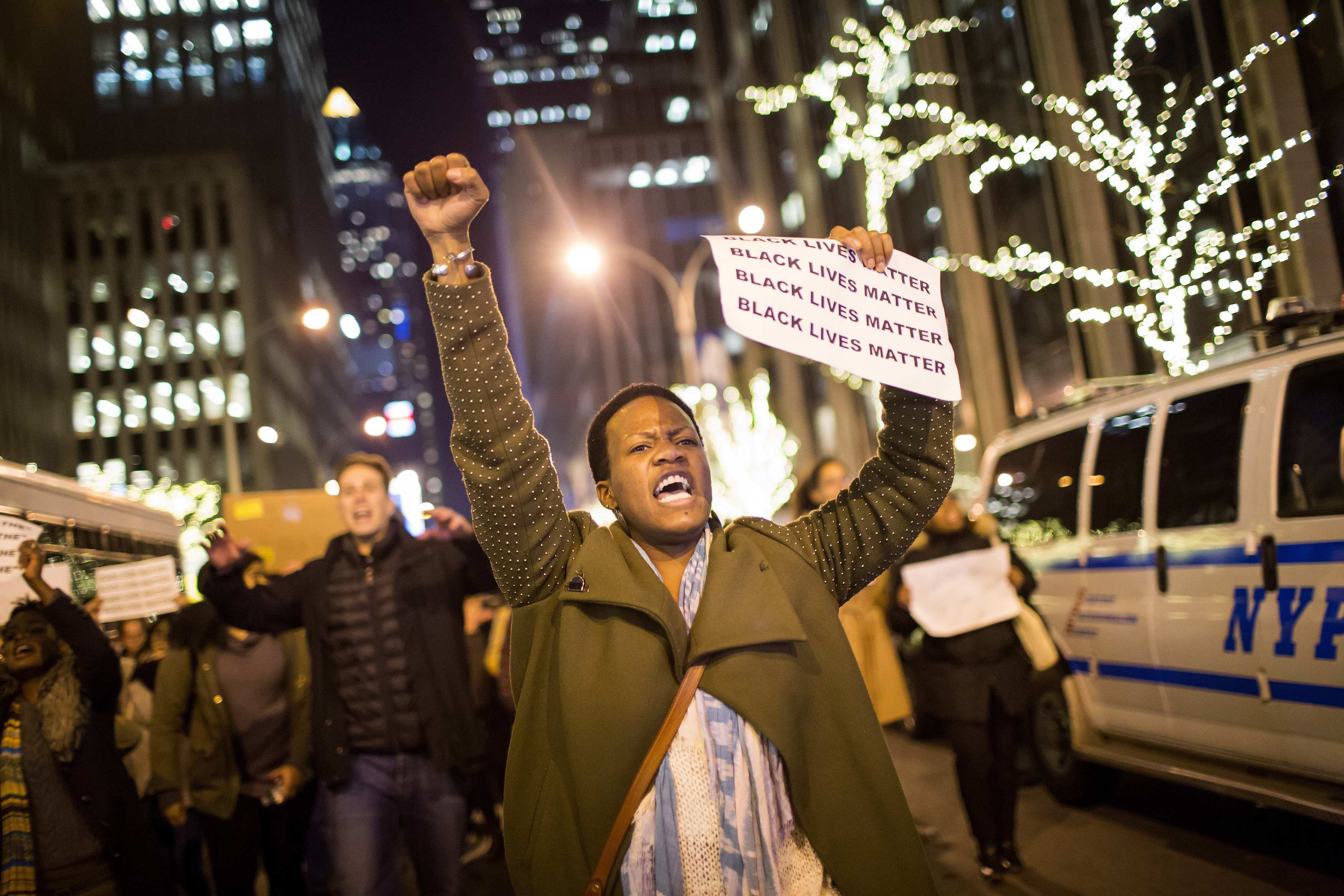 People take part in a protest against the grand jury decision on the death of Eric Garner in midtown Manhattan in New York on Dec. 3, 2014. (Eric Thayer—Reuters)