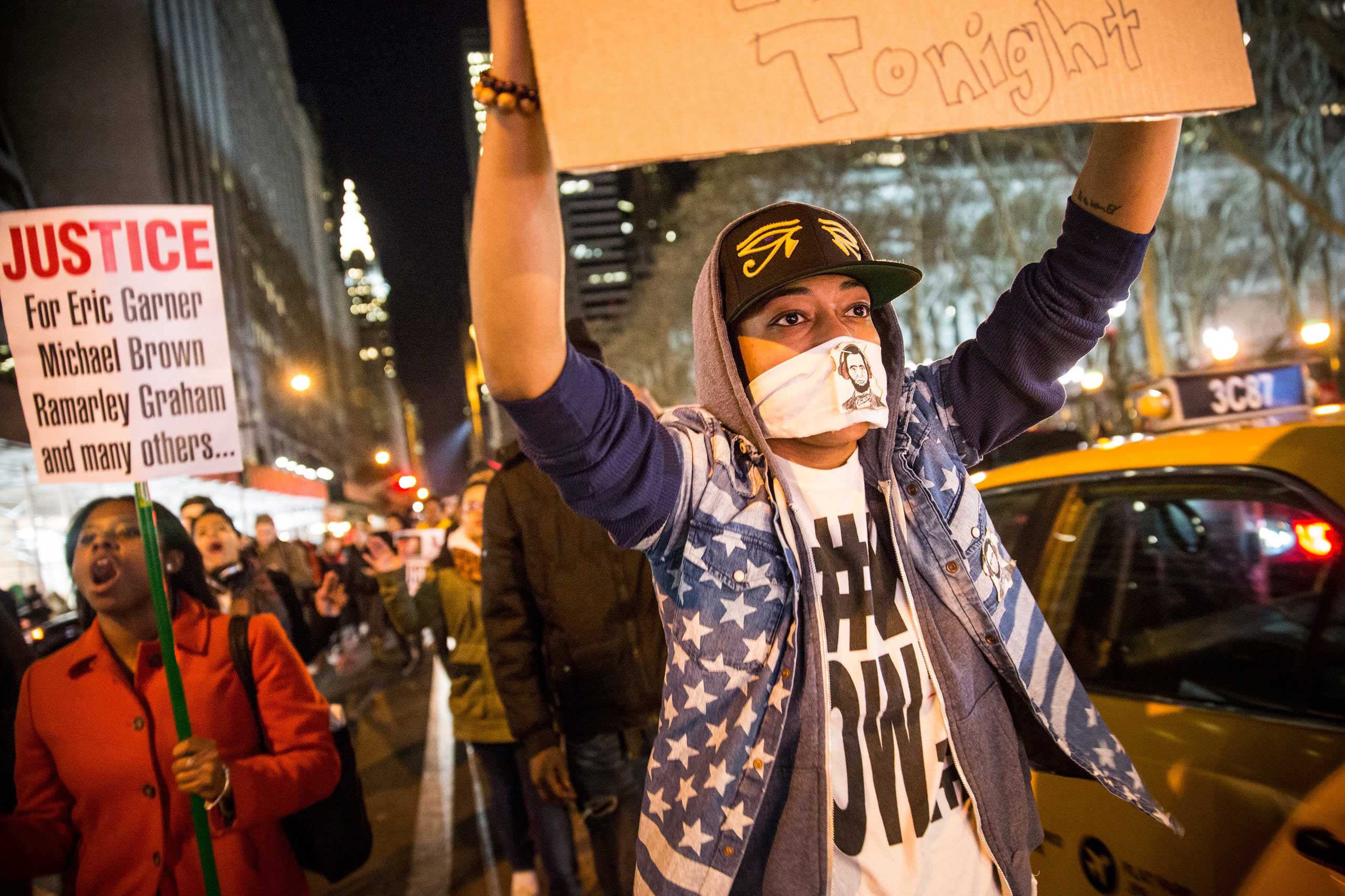 Demonstrators march through the streets of New York City on Dec. 3, 2014.