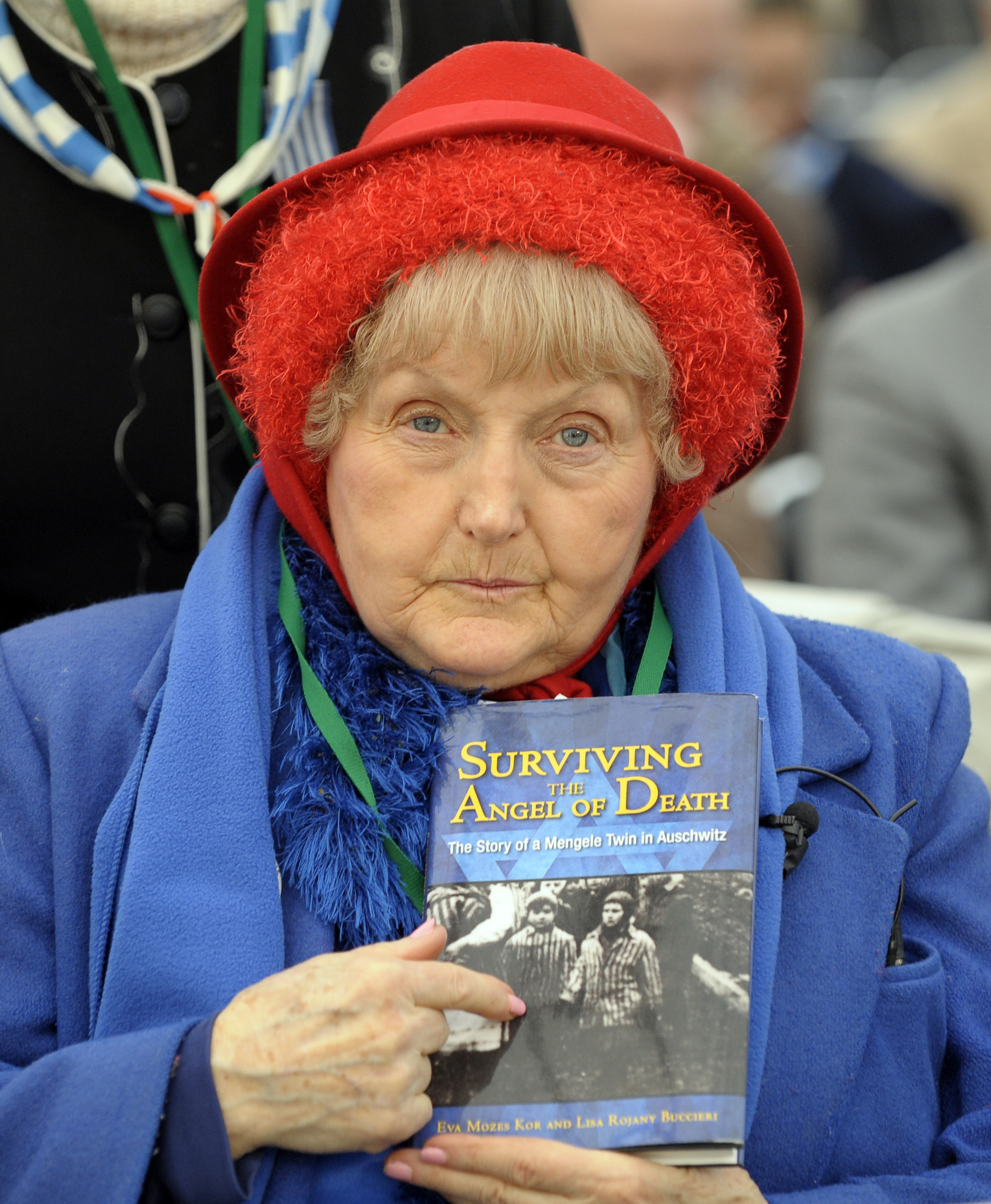 Eva Mozes Kor, a twin who survived pseudo-medical experiments at the Nazi Auschwitz death camp by Dr Josef Mengele points to a wartime picture of her sister Miriam and herself on Jan. 27, 2010.