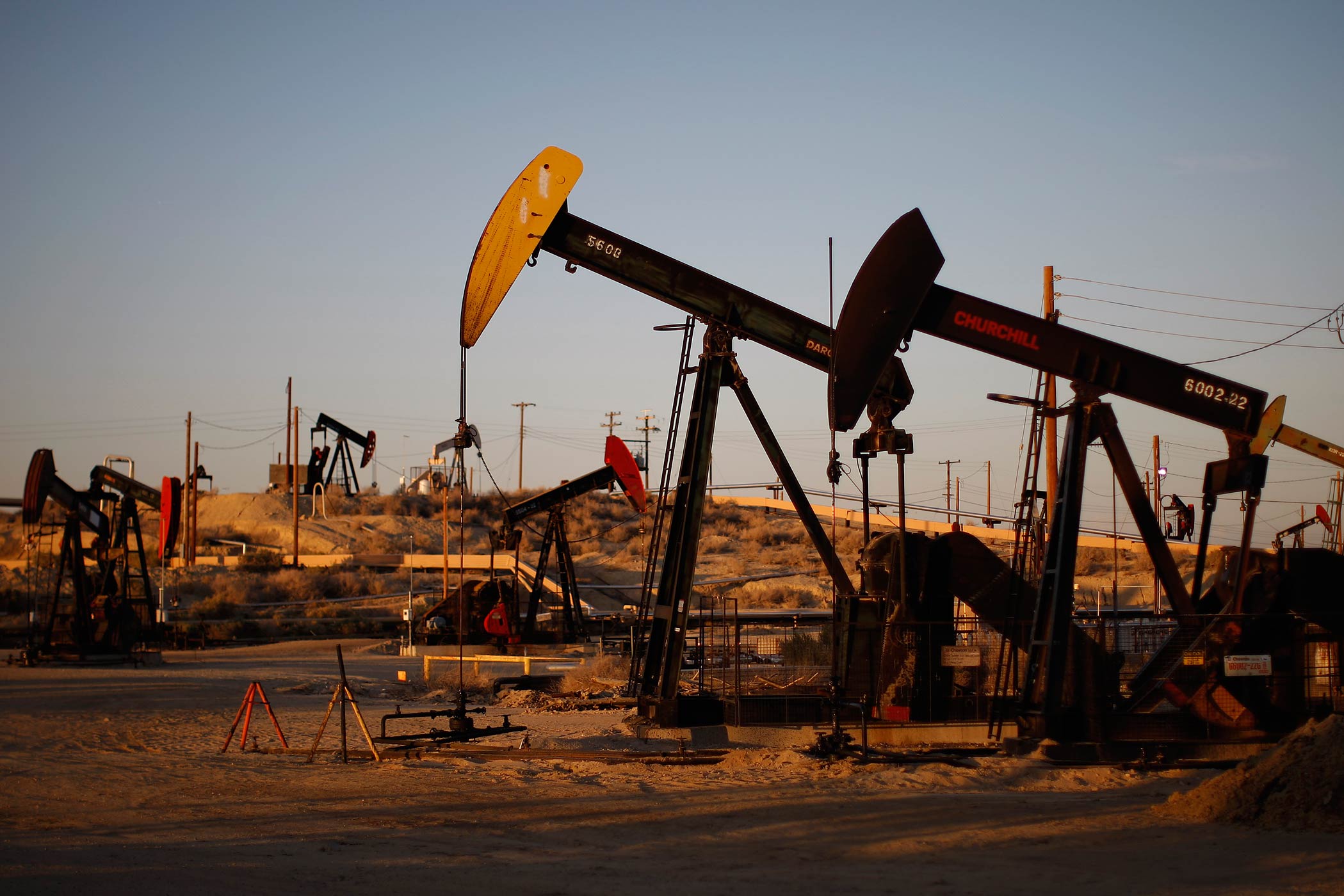 Pump jacks and wells are seen in an oil field that uses fracking on the Monterey Shale formation near McKittrick, Ca. on March 23, 2014. (David McNew—Getty Images)