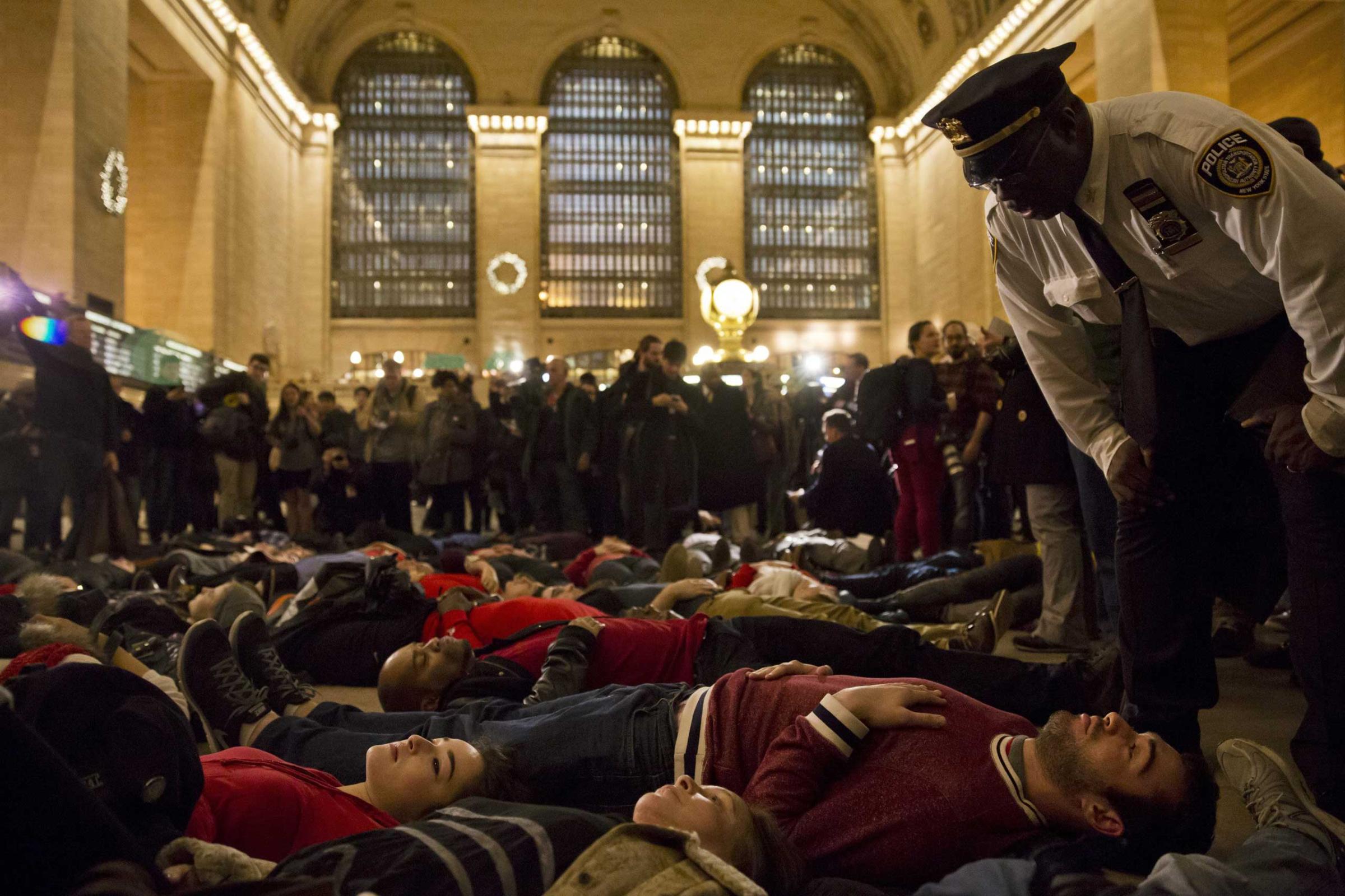 United States: Protests over the grand jury's decision not to bring charges in the death of Eric Garner A 'die-in' in New York's Grand Central Terminal, Dec. 3, 2014.