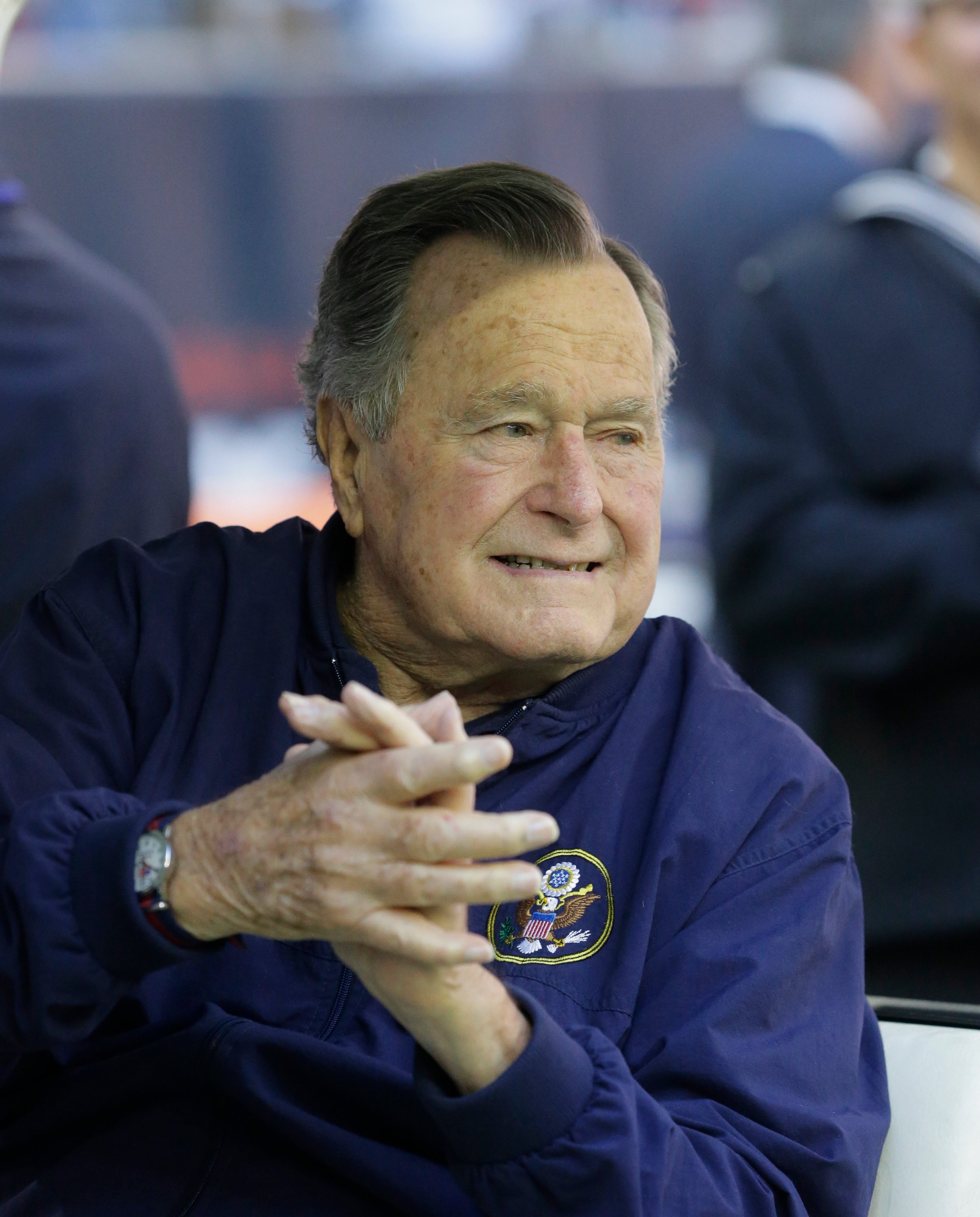 Former president George H. W. Bush attends an NFL football game between the Houston Texans an Cincinnati Bengals on Nov. 23, 2014, in Houston.