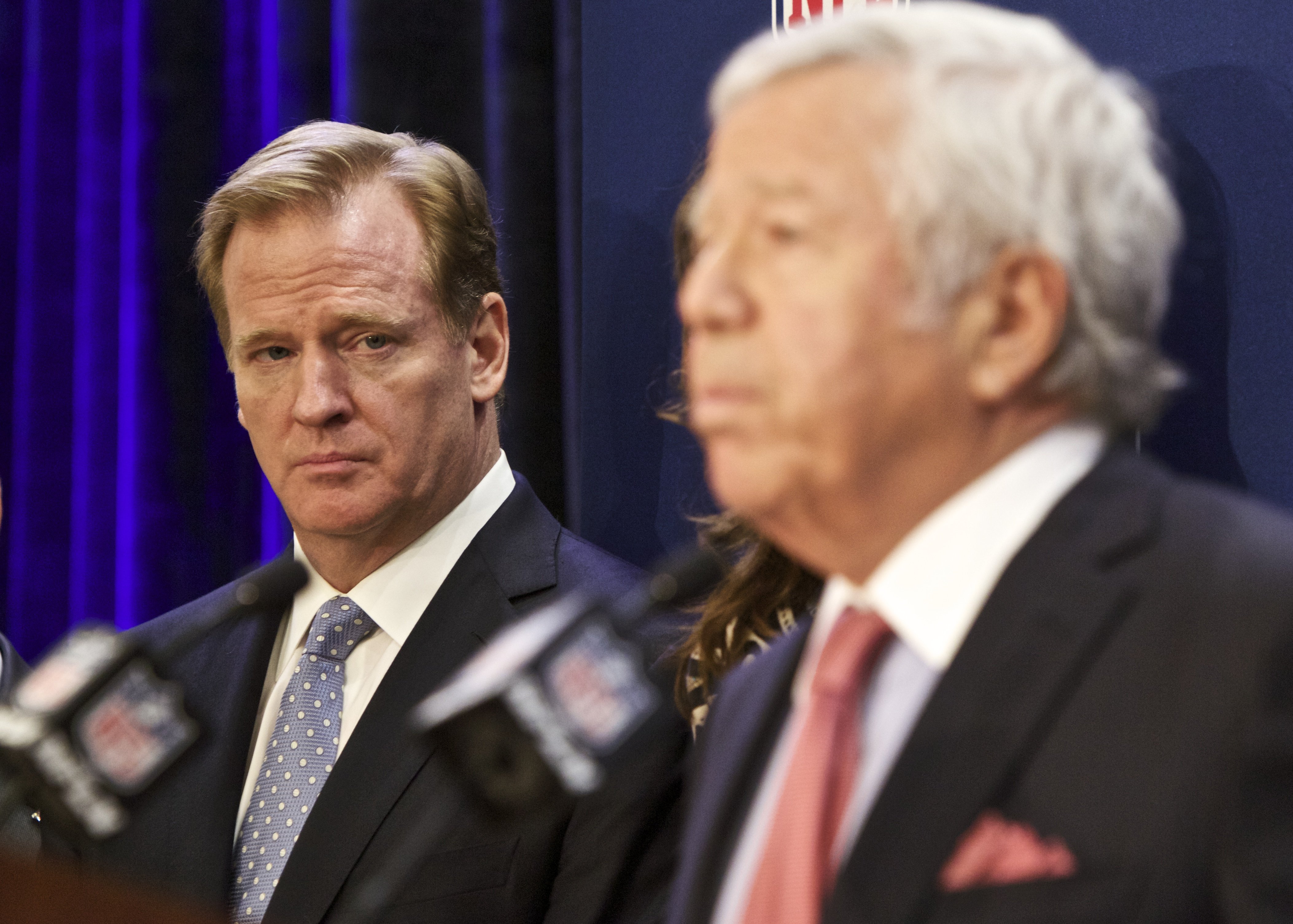 NFL commissioner Roger Goodell looks on as New England Patriots owner Robert Kraft speaks at an NFL press conference announcing new measures for the league's personal conduct policy during an owners meeting on Dec. 10, 2014, in Irving, Texas.