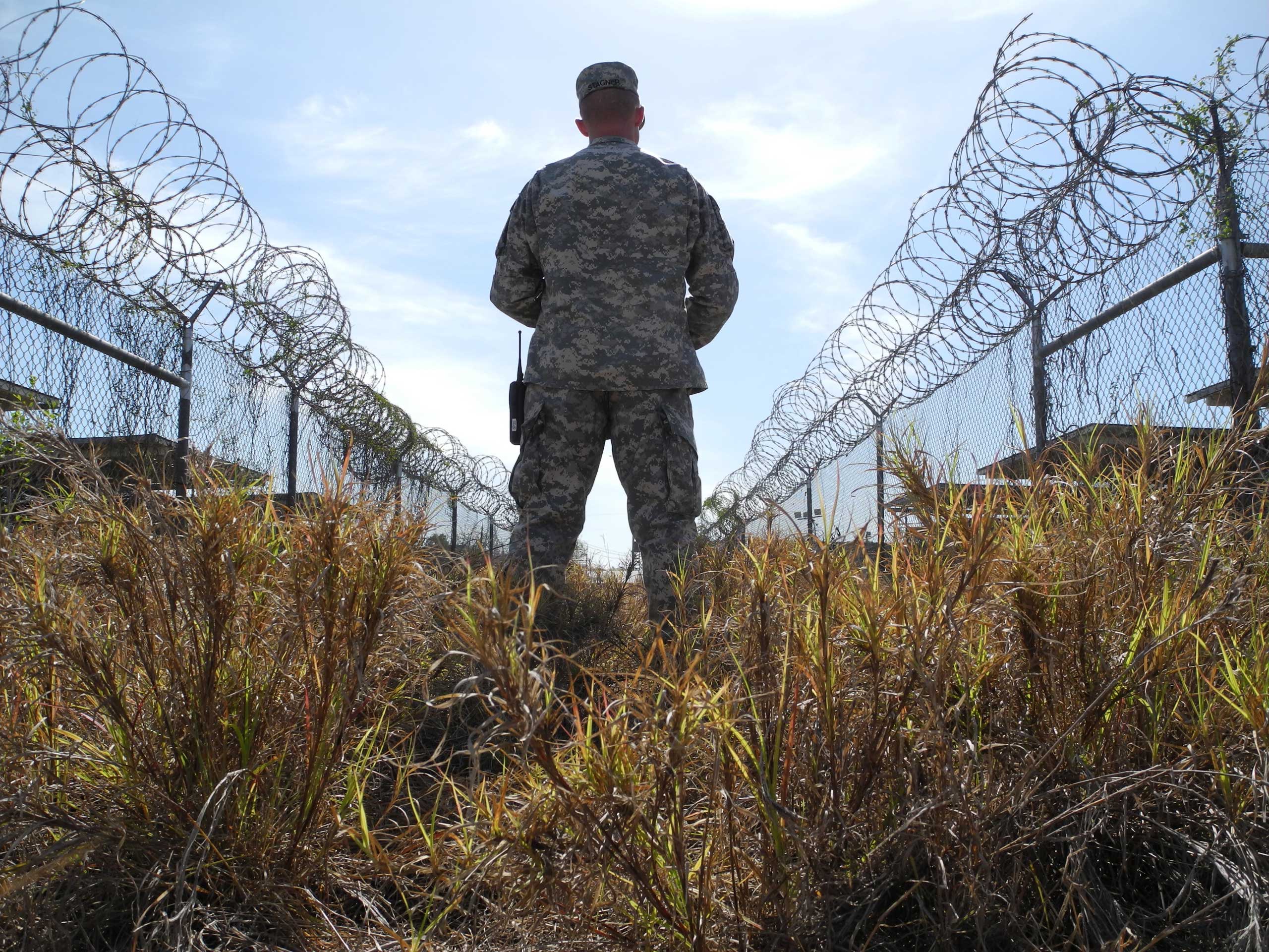 A U.S. military guard on the grounds of the now closed Camp X-Ray in Guantanamo Bay, Cuba, Aug. 22 2013. (Johannes Schmitt-Tegge—EPA)