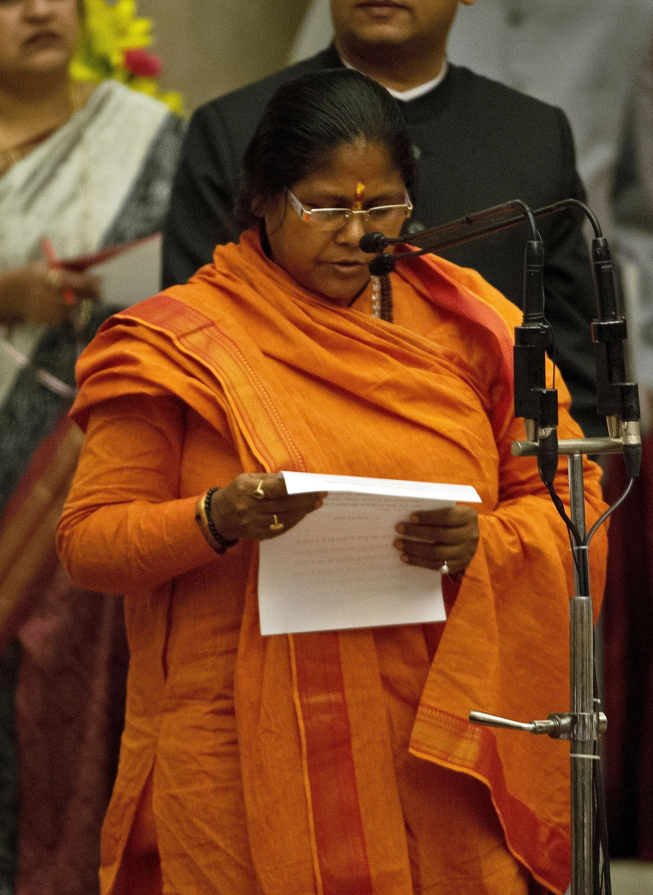 Bharatiya Janata Party leader Niranjan Jyoti takes an oath as a Cabinet minister during a swearing-in ceremony at the presidential palace in New Delhi on Nov. 9, 2014 (Prakash Singh/Pool—EPA)