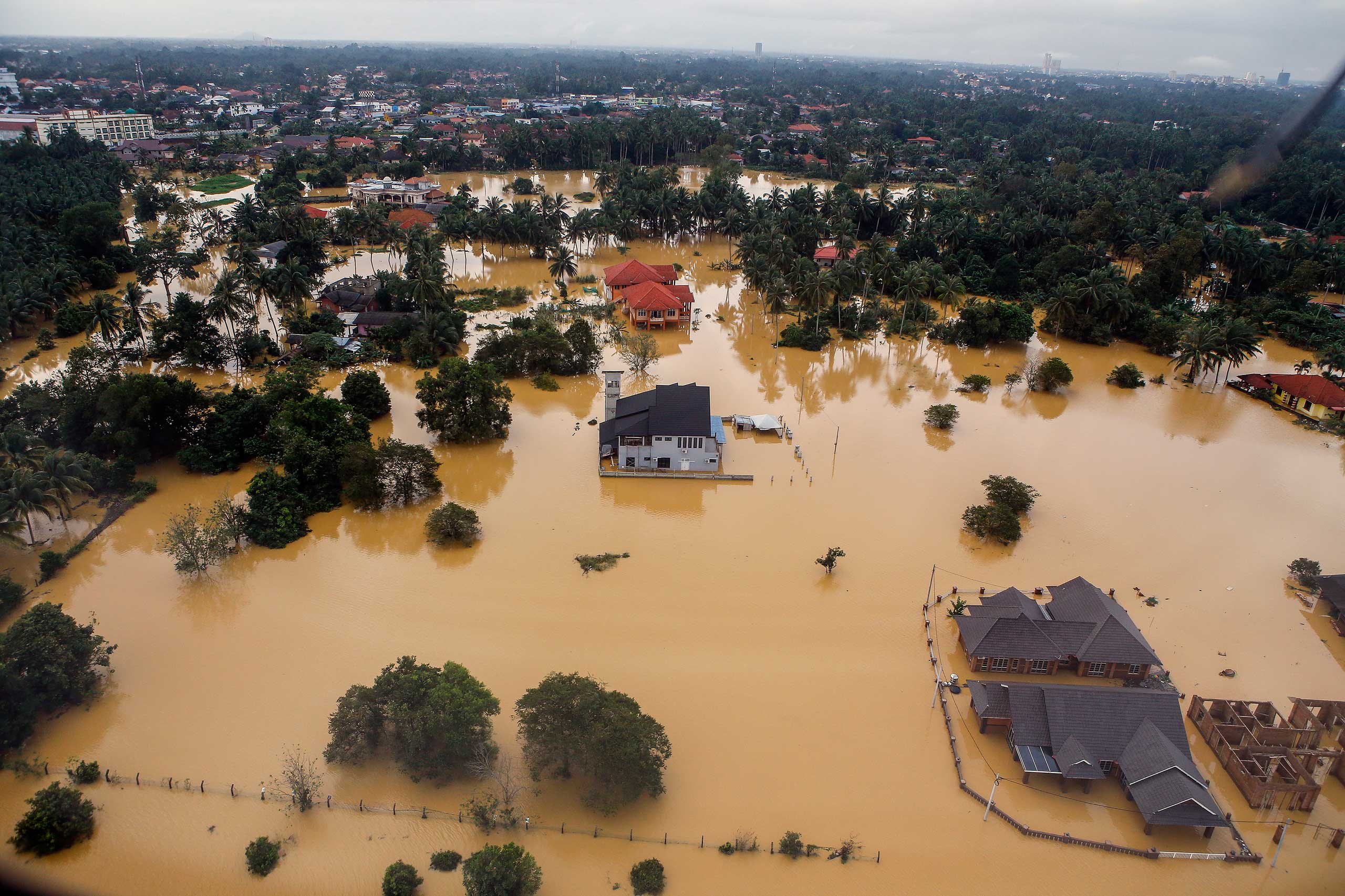 An aerial view of a settlement submerged by floodwaters in the Pengkalan Chepa district of Kelantan, Malaysia, Dec. 28, 2014. (Azhar Rahim—EPA)