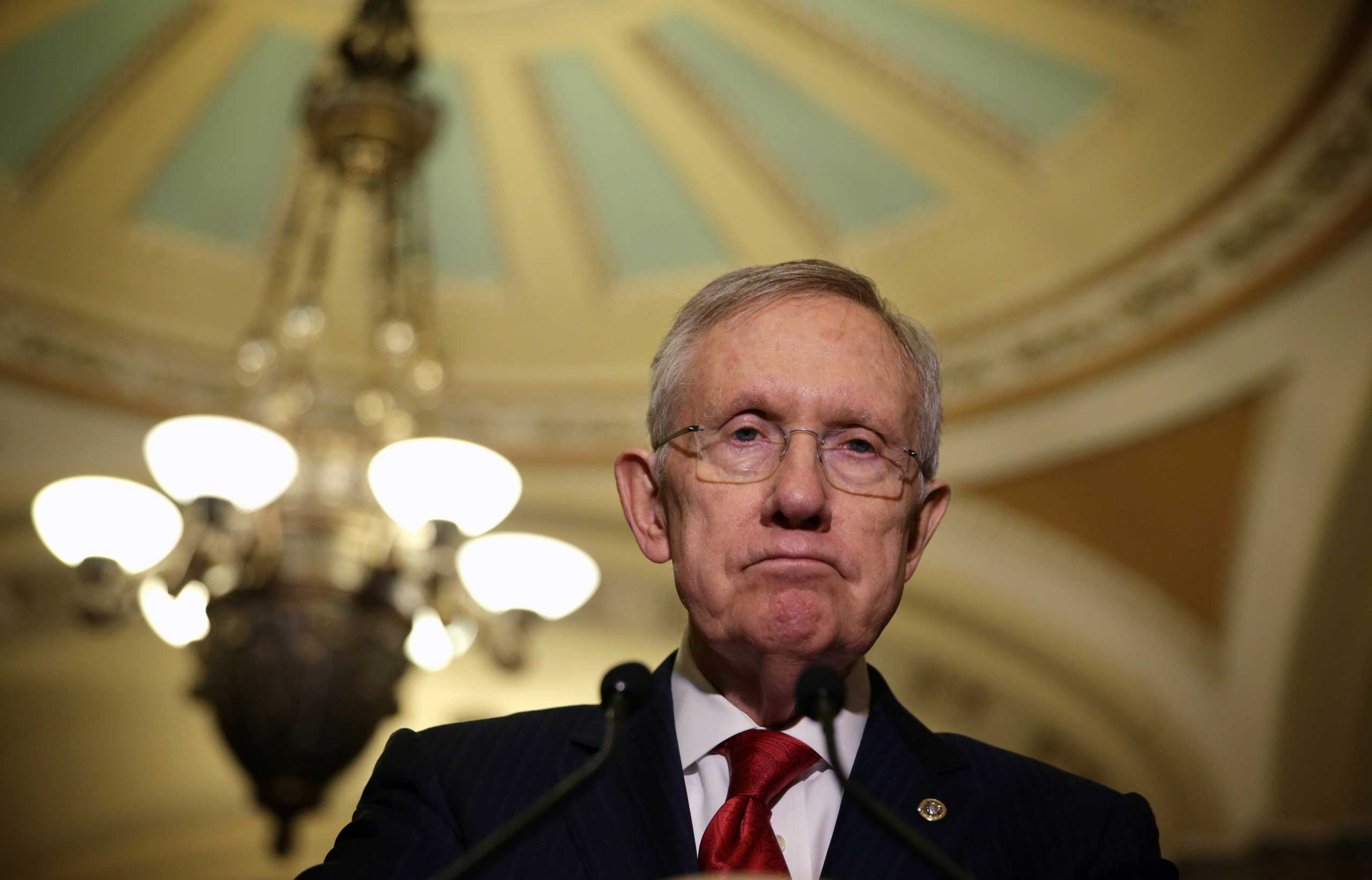 Senate Majority Leader Sen. Harry Reid speaks to members of the media after the Senate Democratic Policy Luncheon at the Capitol Dec. 9, 2014 on Capitol Hill in Washington, DC. (Alex Wong—Getty Images)