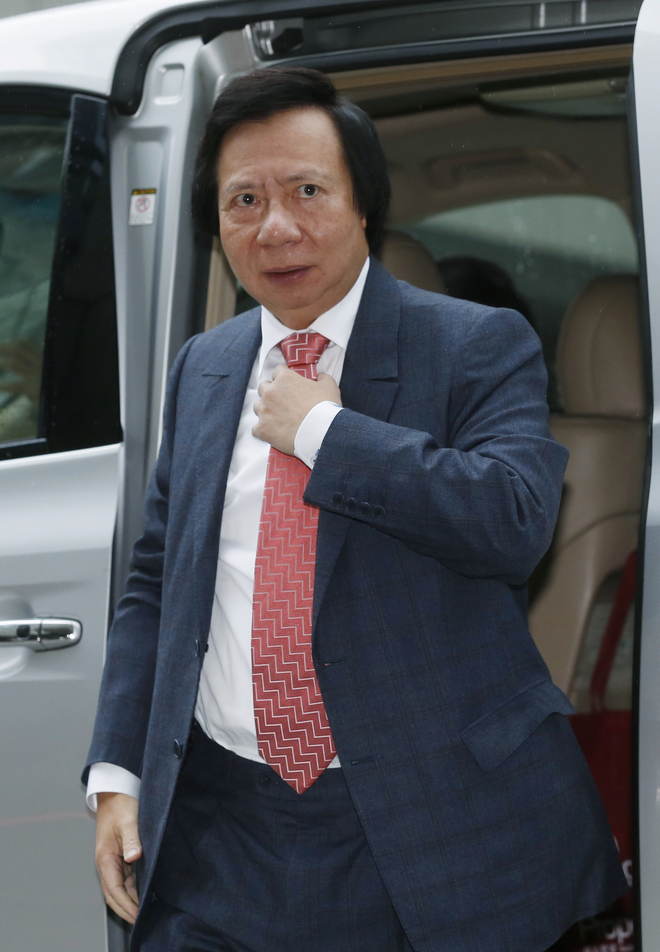 Thomas Kwok, co-chairman of Hong Kong developer Sun Hung Kai Properties, arrives at the High Court in Hong Kong on Dec. 19, 2014 (Kin Cheung—AP)