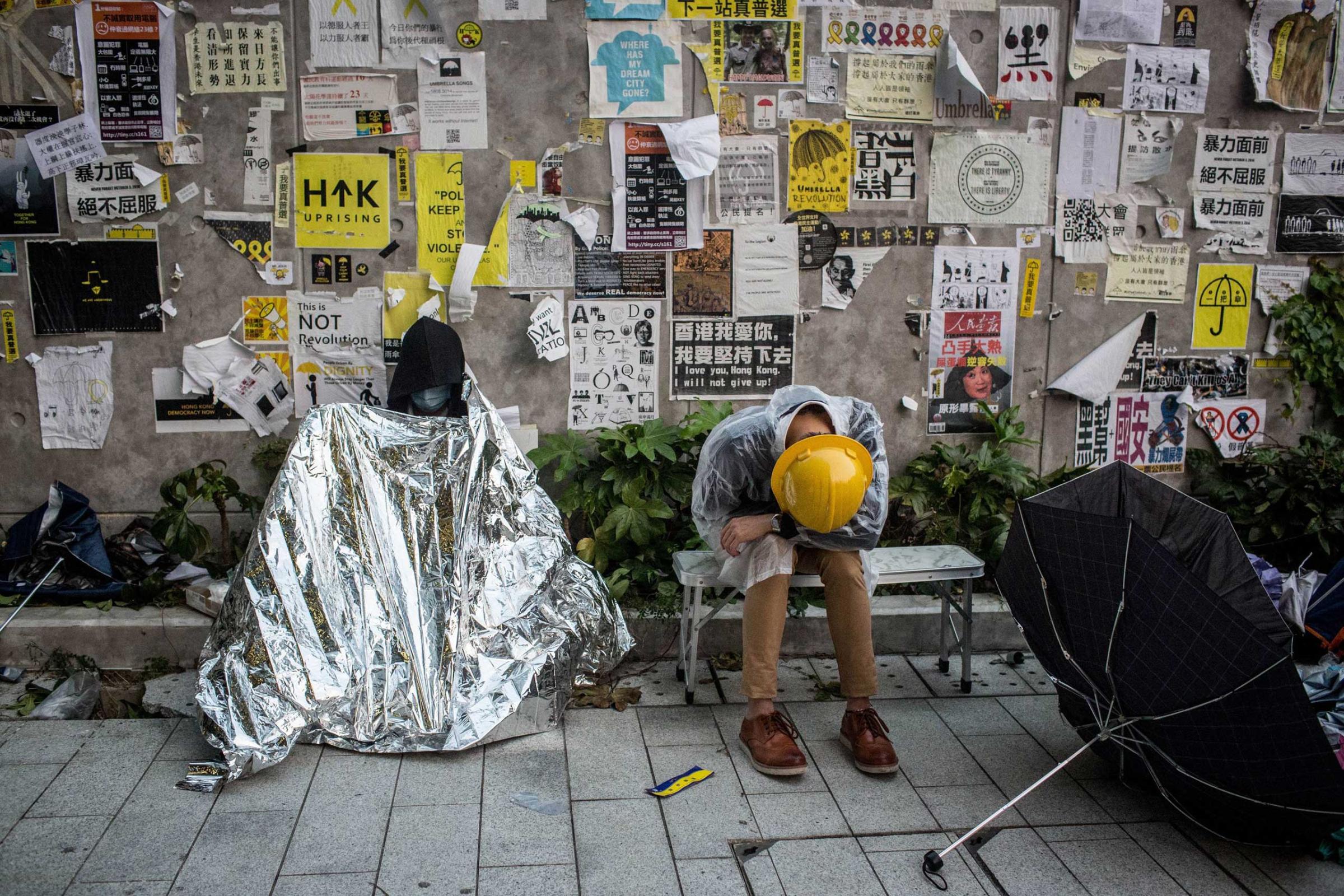 Pro-democracy activists sleep outside the Legislative Council building after protesters clashed with police on Nov. 19, 2014 in Hong Kong.