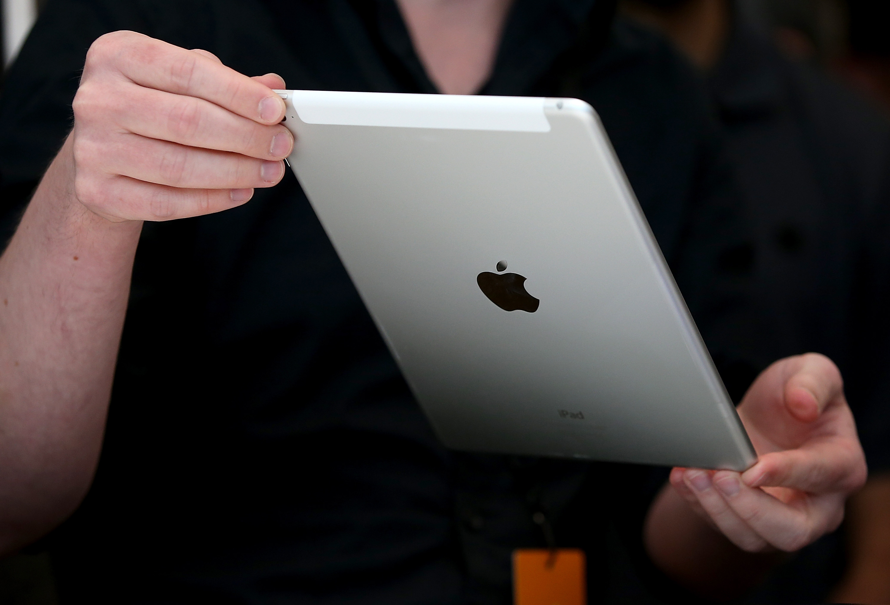 An attendee inspects new iPad Air 2 during an Apple special event on Oct. 16, 2014 in Cupertino, Calif.