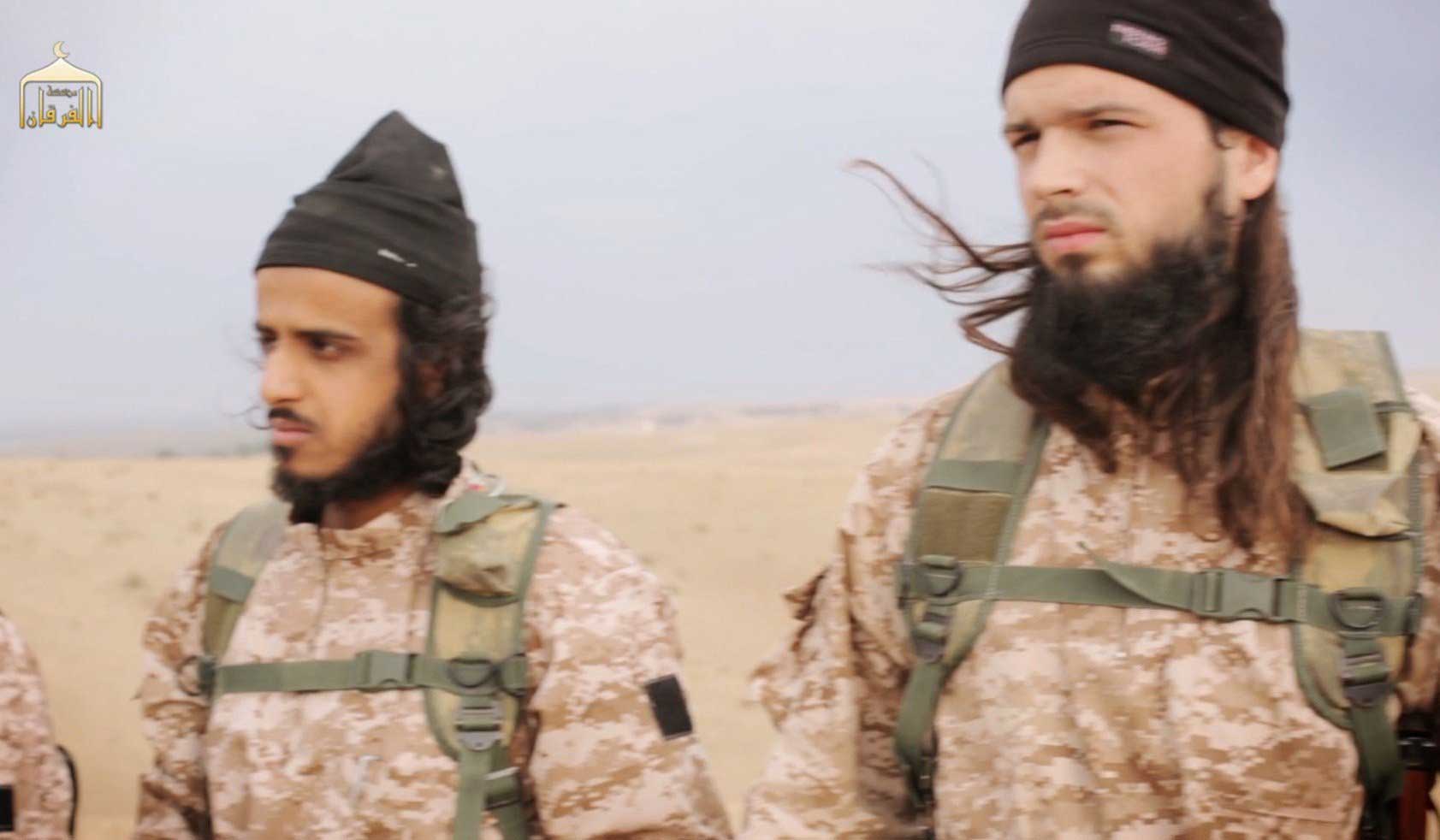 A frame grab from a propaganda video released on Nov. 16, 2014 shows members of The Islamic State in Iraq and Syria, with among them French citizen Maxime Hauchard, before taking part in the beheadings of Syrian soldiers. (AFP/Getty Images)