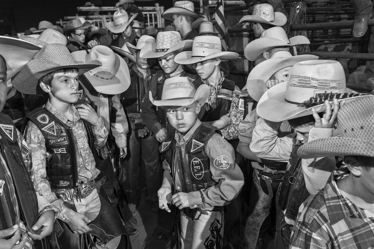 August 2, 2014: Finalist mutton busters and calf riders wait in the arena alley before the invocation and their introduction on the final day of competition.