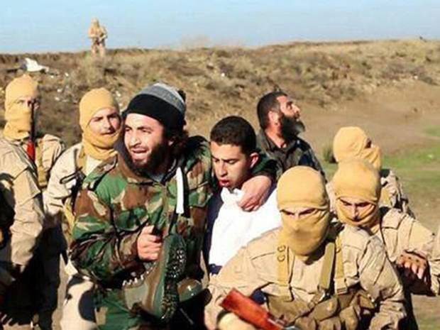 A still image released by the Islamic State on Dec. 24, 2014 purportedly shows a Jordanian pilot captured by ISIS fighters after they shot down a warplane from the US-led coalition with an anti-aircraft missile near Raqqa city. (EPA)