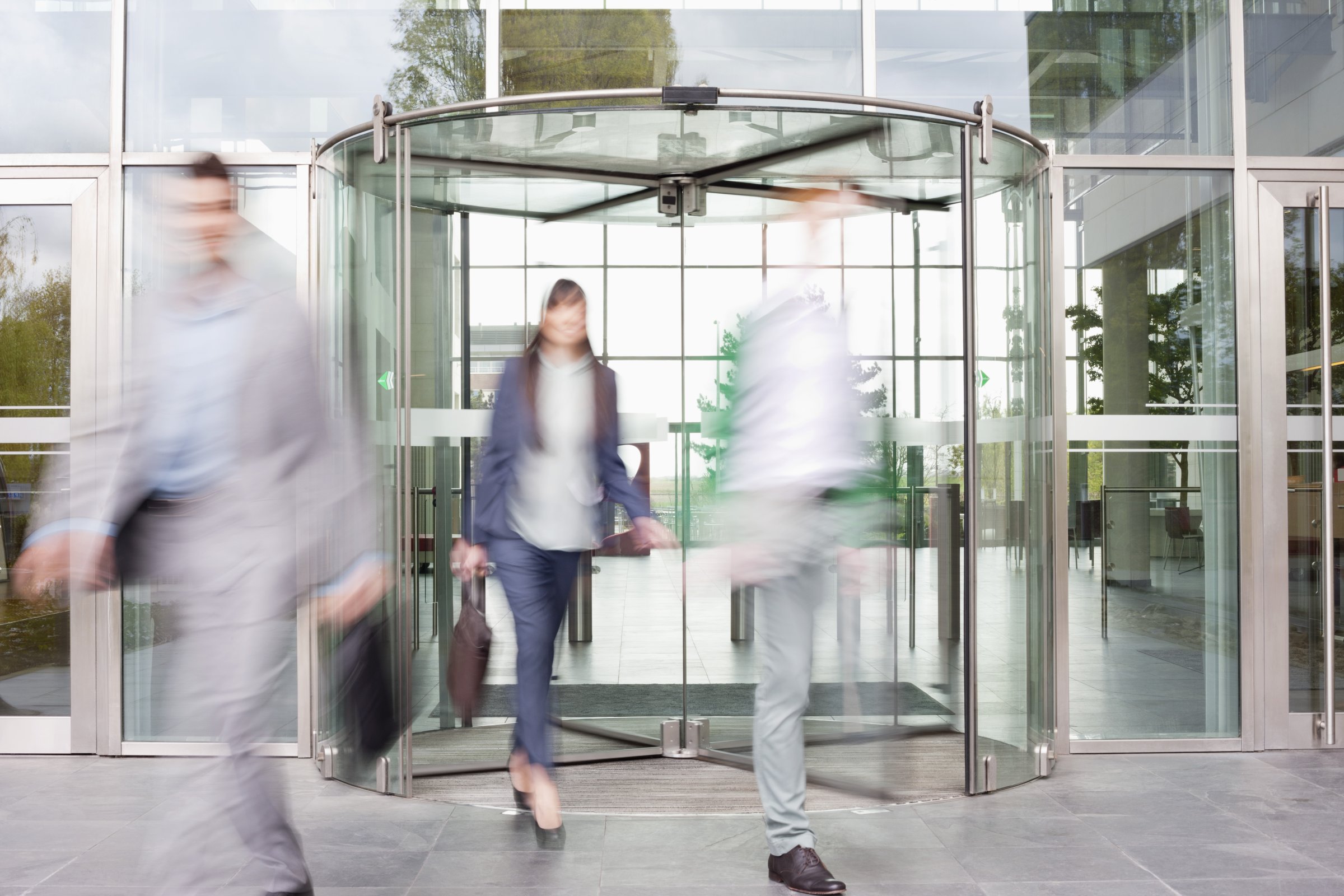 Business executives at entrance of an office building