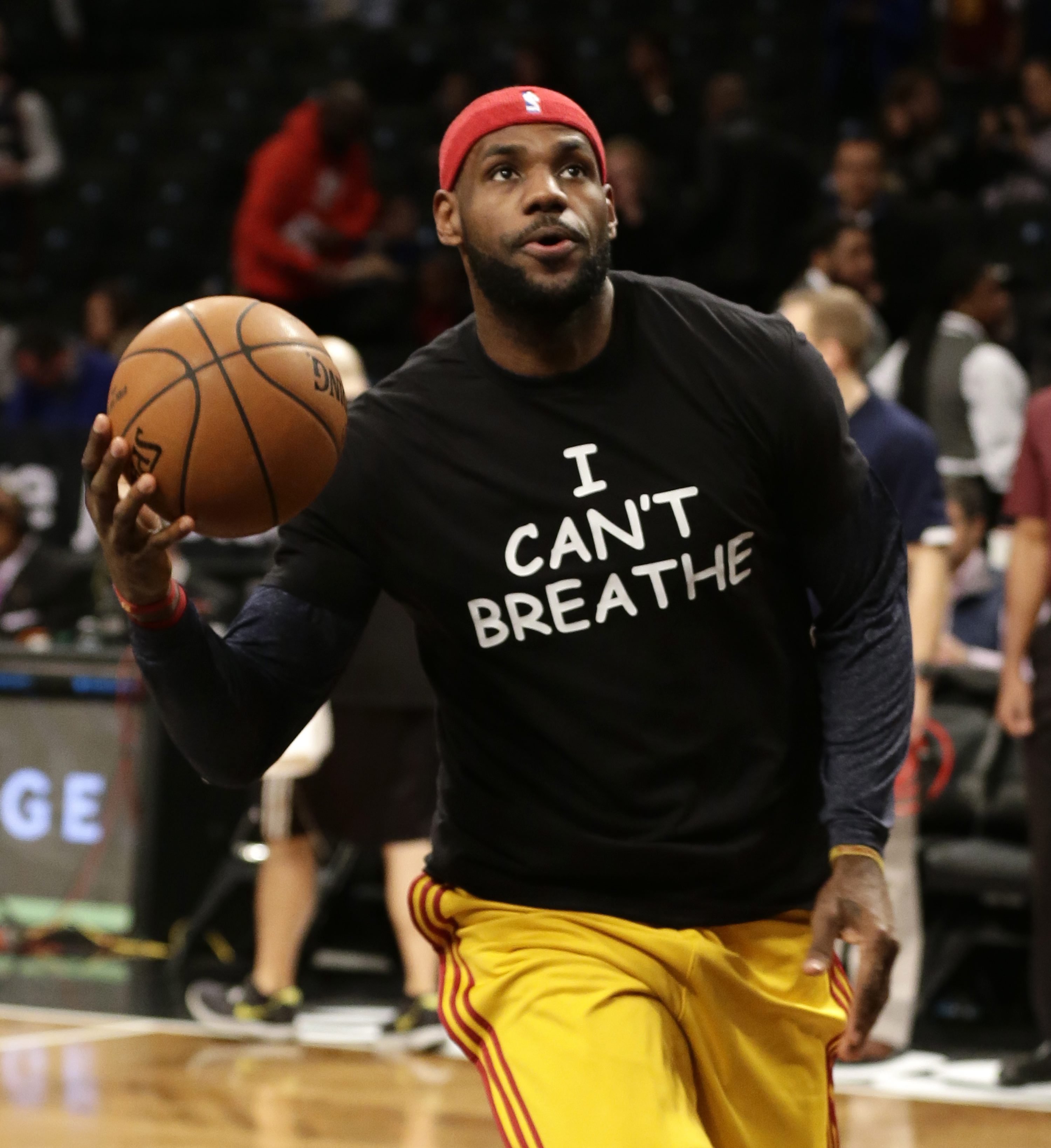Cleveland Cavaliers forward LeBron James warms up before an NBA basketball game against the Brooklyn Nets at the Barclays Center on Dec. 8, 2014, in New York.