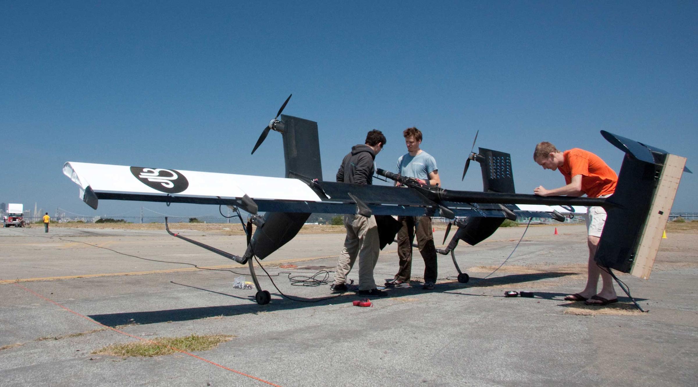 Flight team engineers Kenneth Jensen, left, Damon Vander Lind, center, and Matthew Peddie prepare for the first crosswind test of their 20kW Wing 7 airborne wind turbine prototype in Alameda, Calif. on May 24, 2011