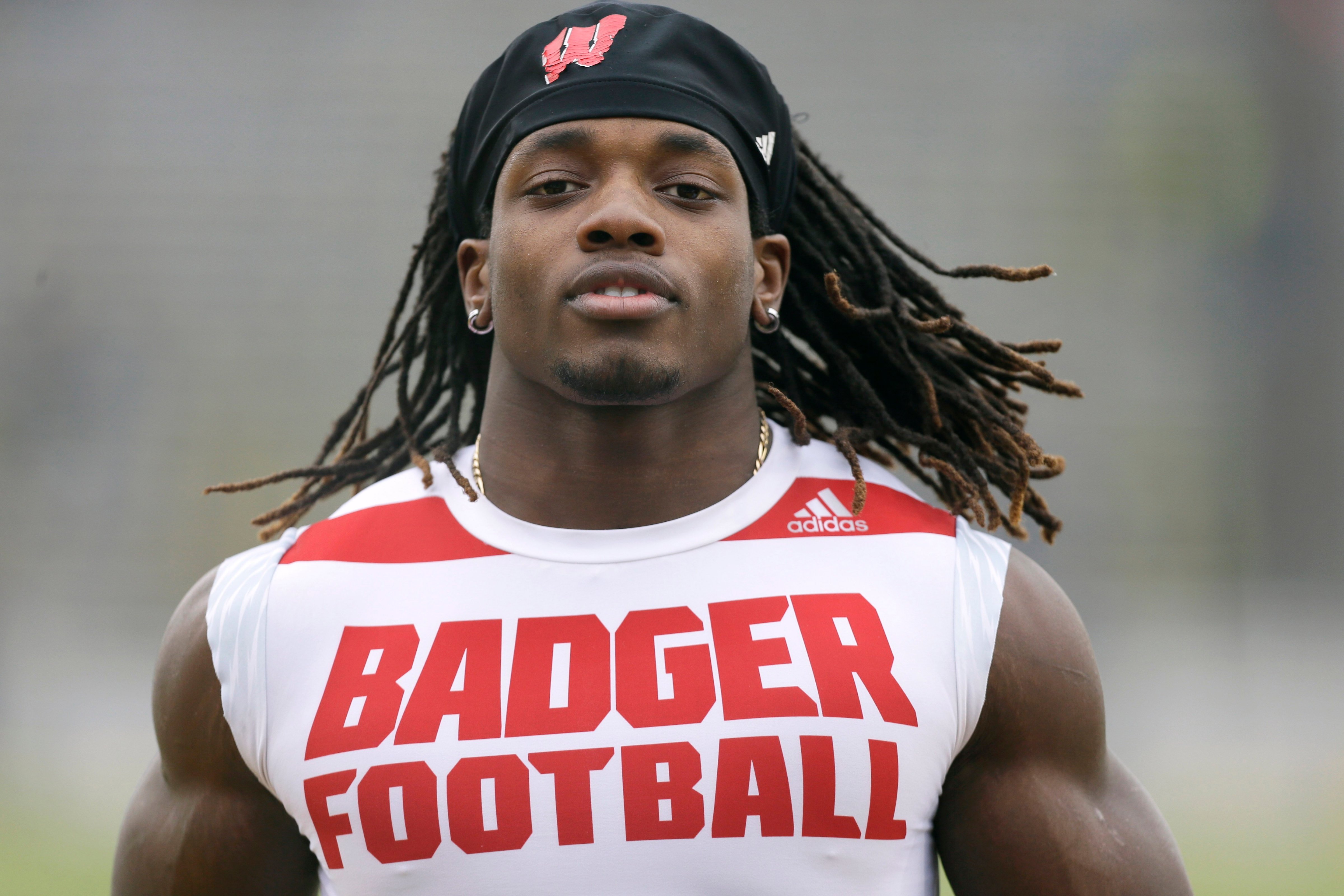 Wisconsin running back Melvin Gordon warming up on the field before an NCAA college football game against Iowa in Iowa City, Iowa.