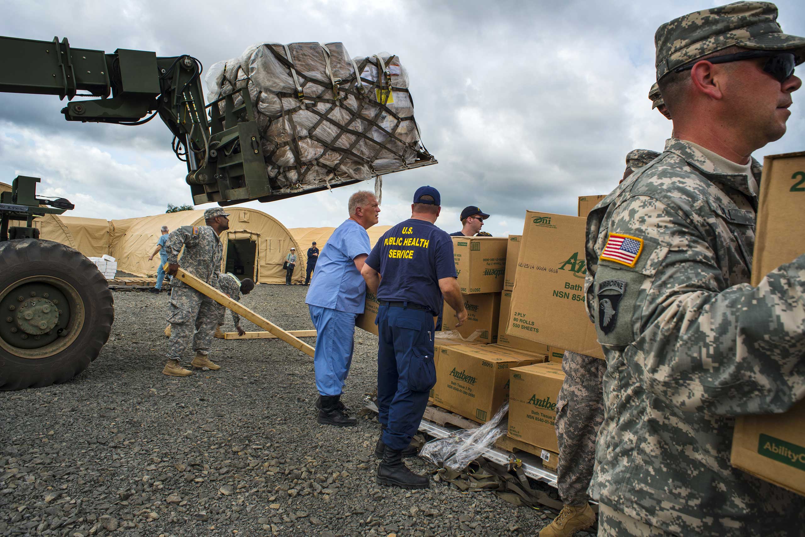 U.S. military and the U.S. Public Health Service staff unload cargo at the Monrovia Medical Unit on Tuesday Nov. 4, 2014 in Monrovia, Liberia.