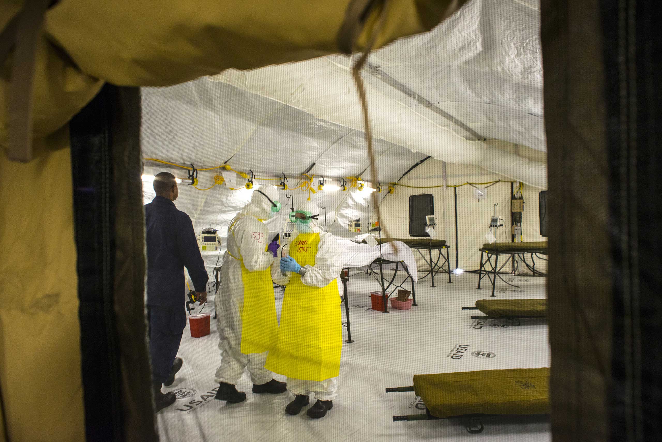 Medical staff simulate treating an Ebola patient inside the Monrovia Medical Unit on Nov.4, 2014 in Monrovia, Liberia.