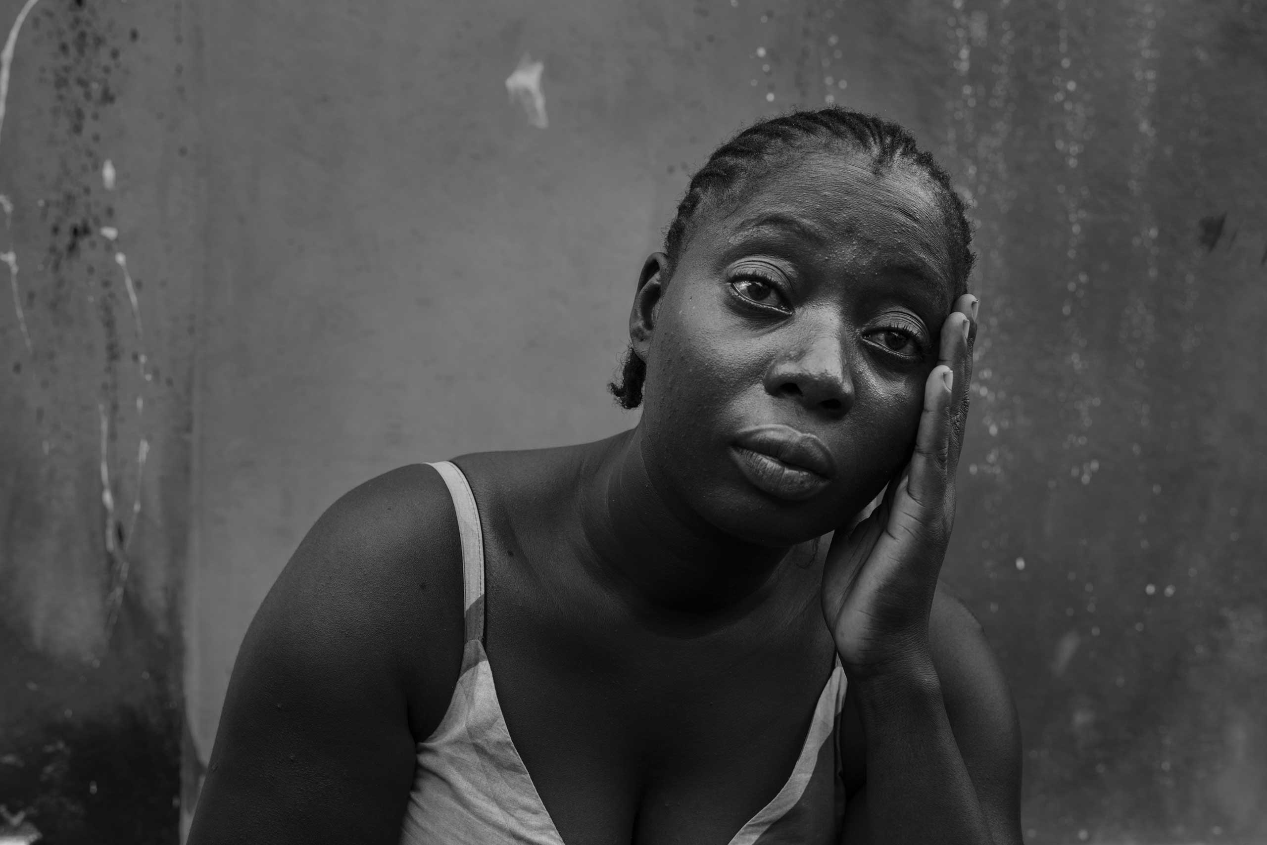 Deedee Urey whose husband and 4 month old baby died in September of Ebola, cries as she ponders her ordeal on Nov. 11, 2014 in Monrovia, Liberia.