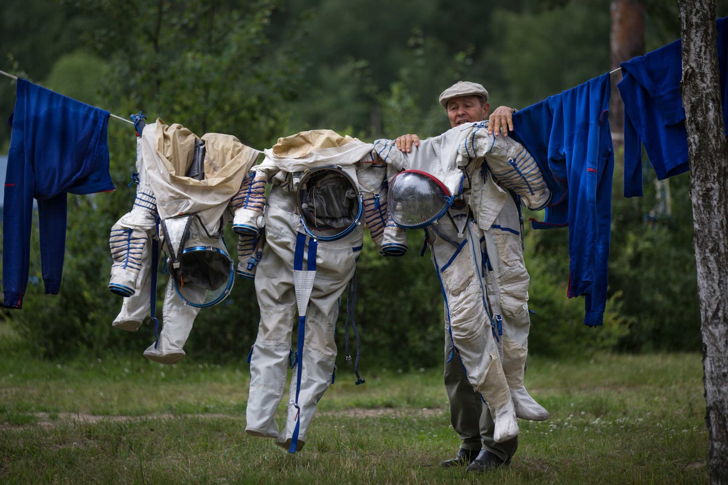 An employee of the Russian Space Training Center hangs space suits out to dry, July 2, 2014.