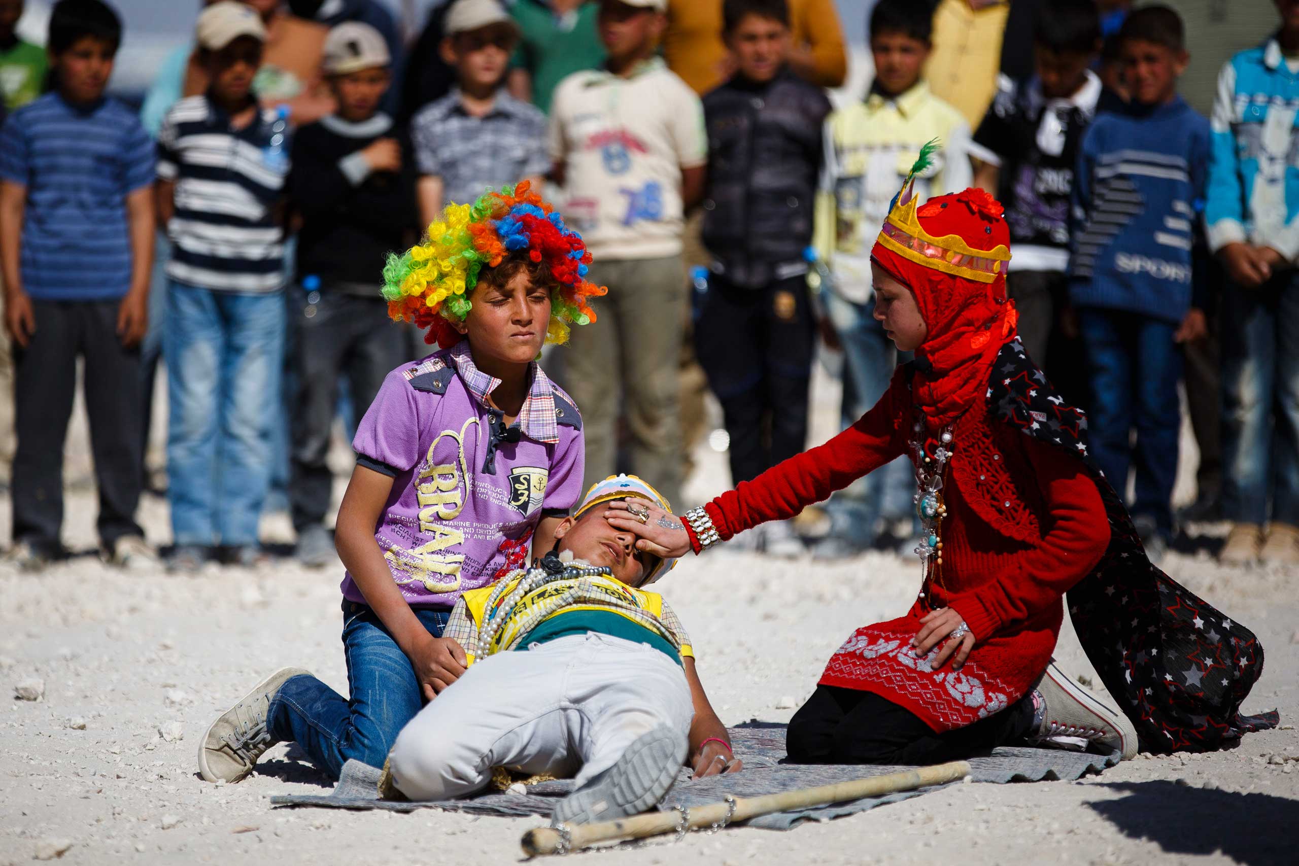 Syrian children perform in an adaptation of Shakespeare's King Lear at the Zaatari Refugee Camp in Mafraq, Jordan, March 27, 2014.