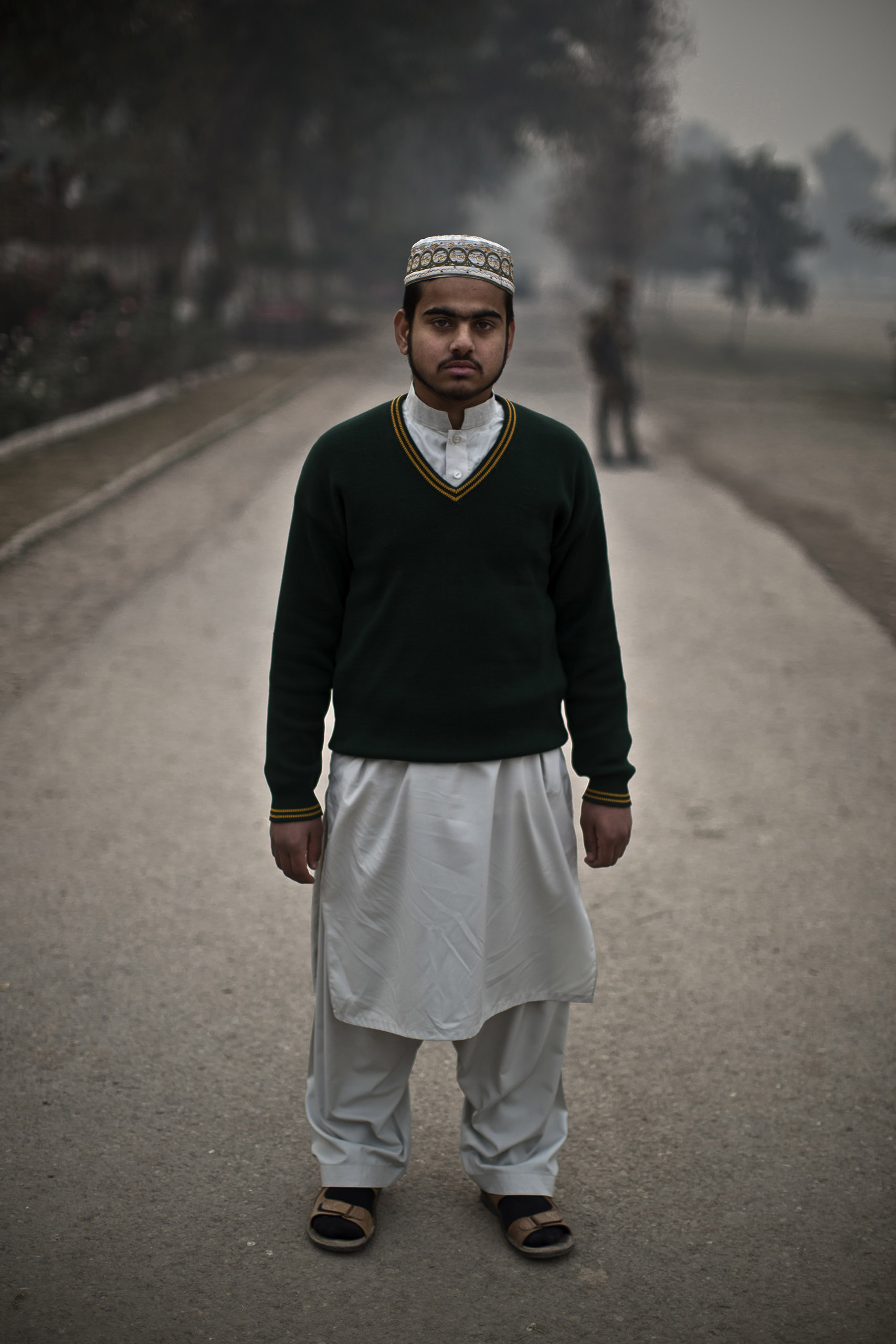 Mohammad Tufail Mumtaz, 14, a student who survived the Pakistani Taliban's attack on the Army Public School on Dec. 16, in the school's yard. Peshawar, Pakistan. Dec. 21, 2014.
                              
                               I was totally covered with bodies over me and around me as the shooting was from behind me,  Mohammad recalled from the scene in the auditorium.  I closed my eyes, I stopped my breathing and I lost track of time.