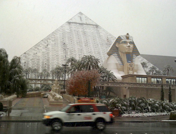 In this Dec. 17, 2008, file photo, snow covers the sides and sphinx of the Luxor Hotel on the Las Vegas Strip (John Gurzinski—AP)
