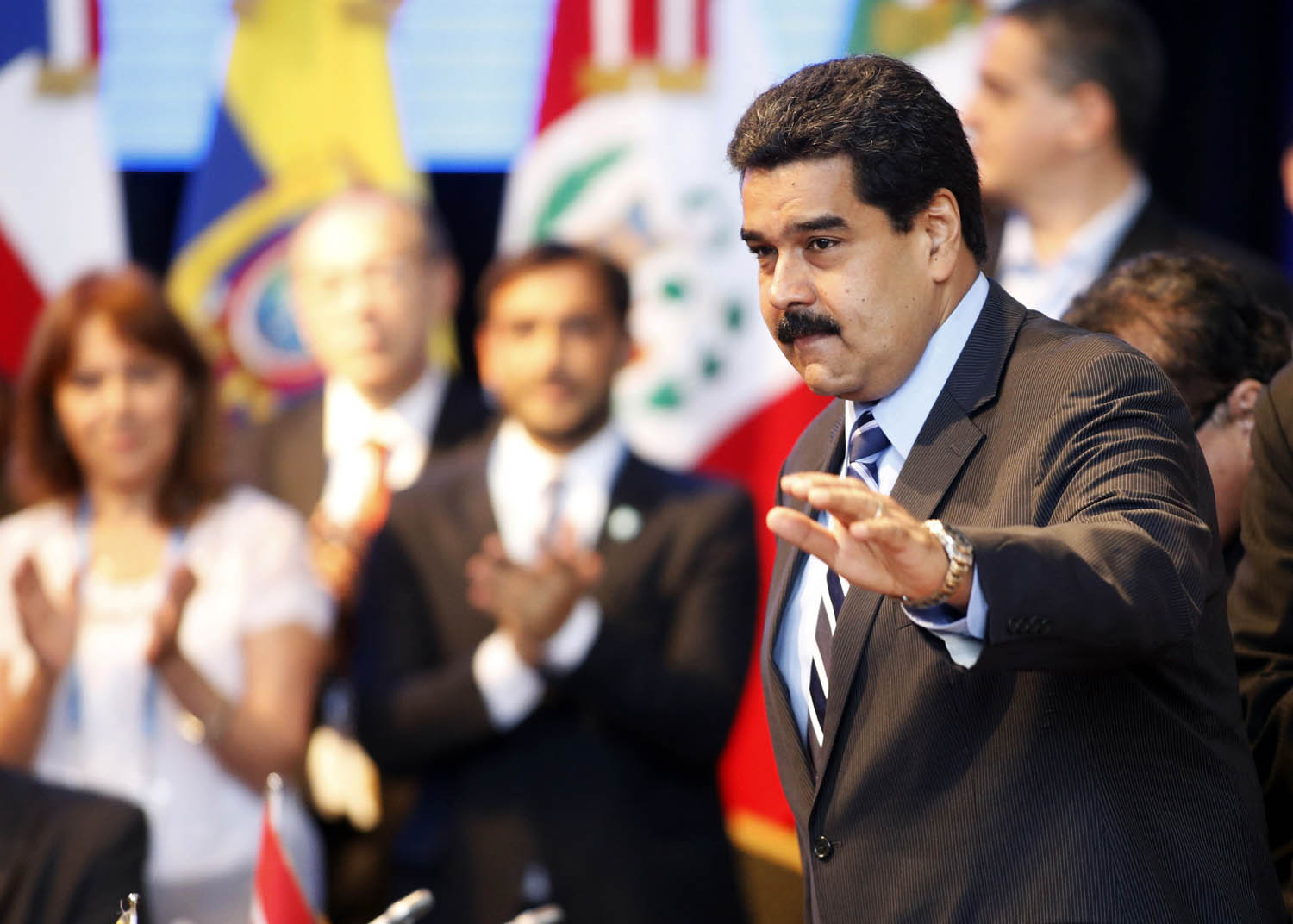 Venezuela's President Nicol&aacute;s Maduro, right, gestures during the Southern Common Market trade bloc's annual presidential 47th summit in Paran&aacute;, Argentina, on Dec. 17, 2014 (Enrique Marcarian—Reuters)