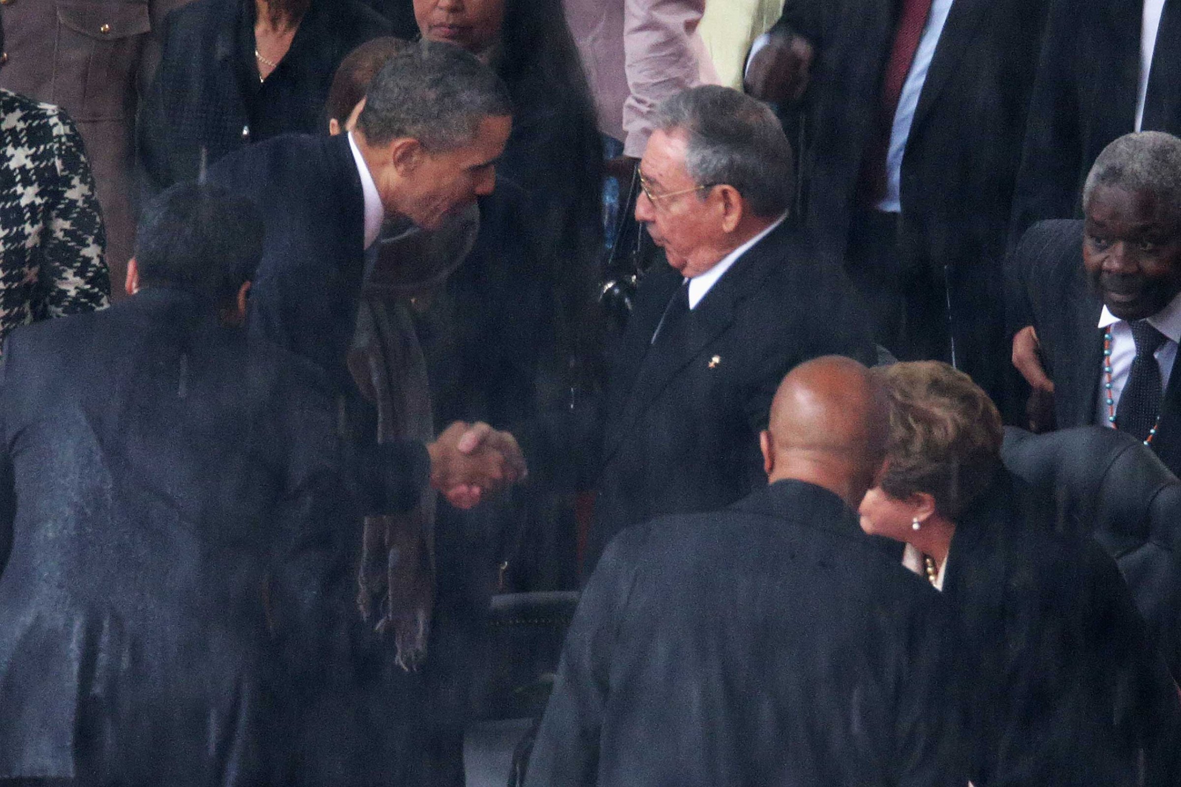 President Barack Obama shakes hands with Cuban President Raul Castro during the official memorial service for former South African President Nelson Mandela at FNB Stadium, Dec. 10, 2013 in Johannesburg, South Africa.
