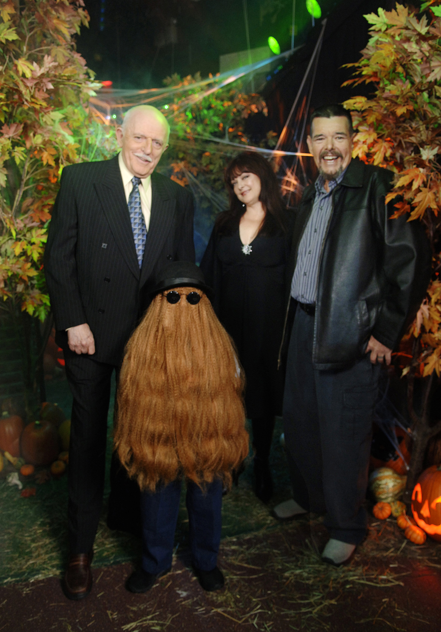 This Oct. 31, 2006, photo provided by ABC, shows some of the original cast of the TV show <i>The Addams Family</i>. From left: John Astin (Gomez Addams), Felix Silla (Cousin Itt), Lisa Loring (Wednesday Addams) and Ken Weatherwax (Pugsley Addams) reunited at a special Halloween edition of ABC's <i>Good Morning America</i> outside their Times Square studios in New York City (Ida Mae Astute—AP)