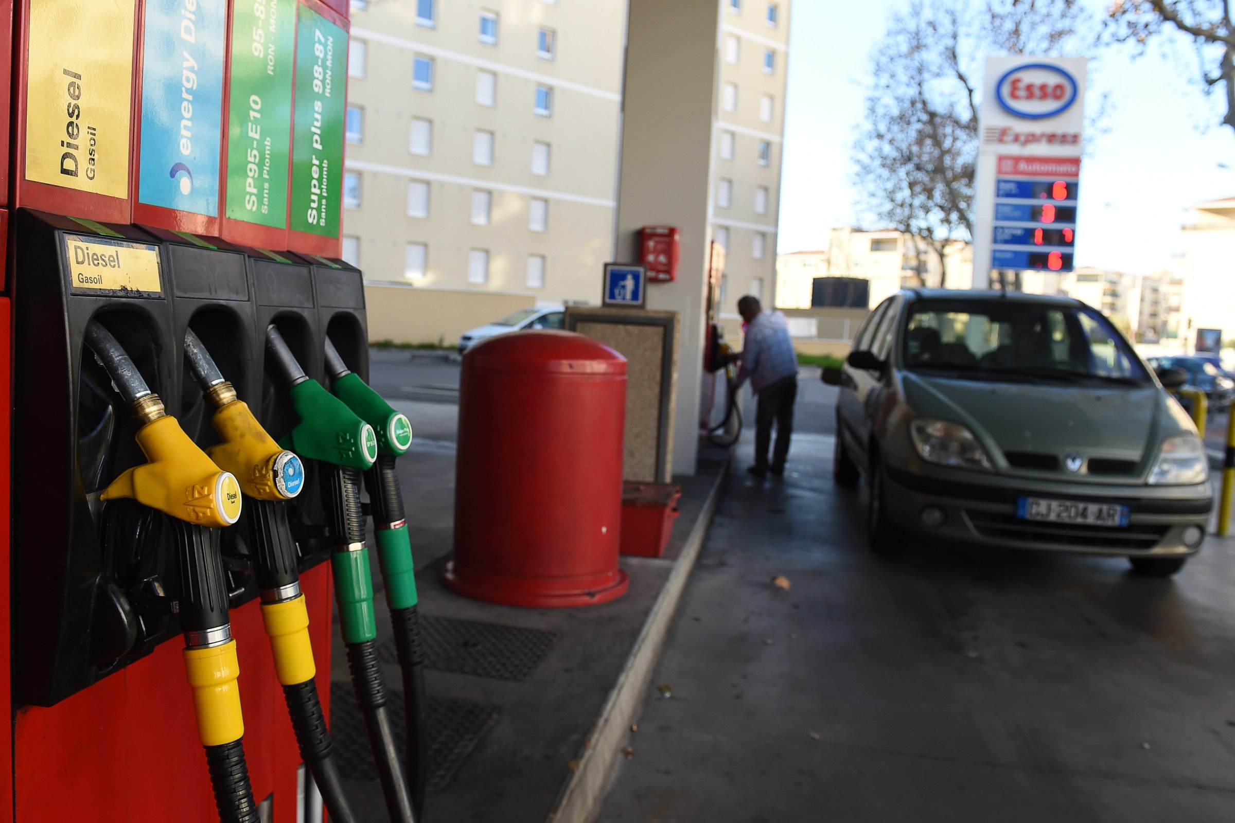 A consumer fills up his fuel tank at a gas station on Dec. 26, 2014 in Marseille, France.