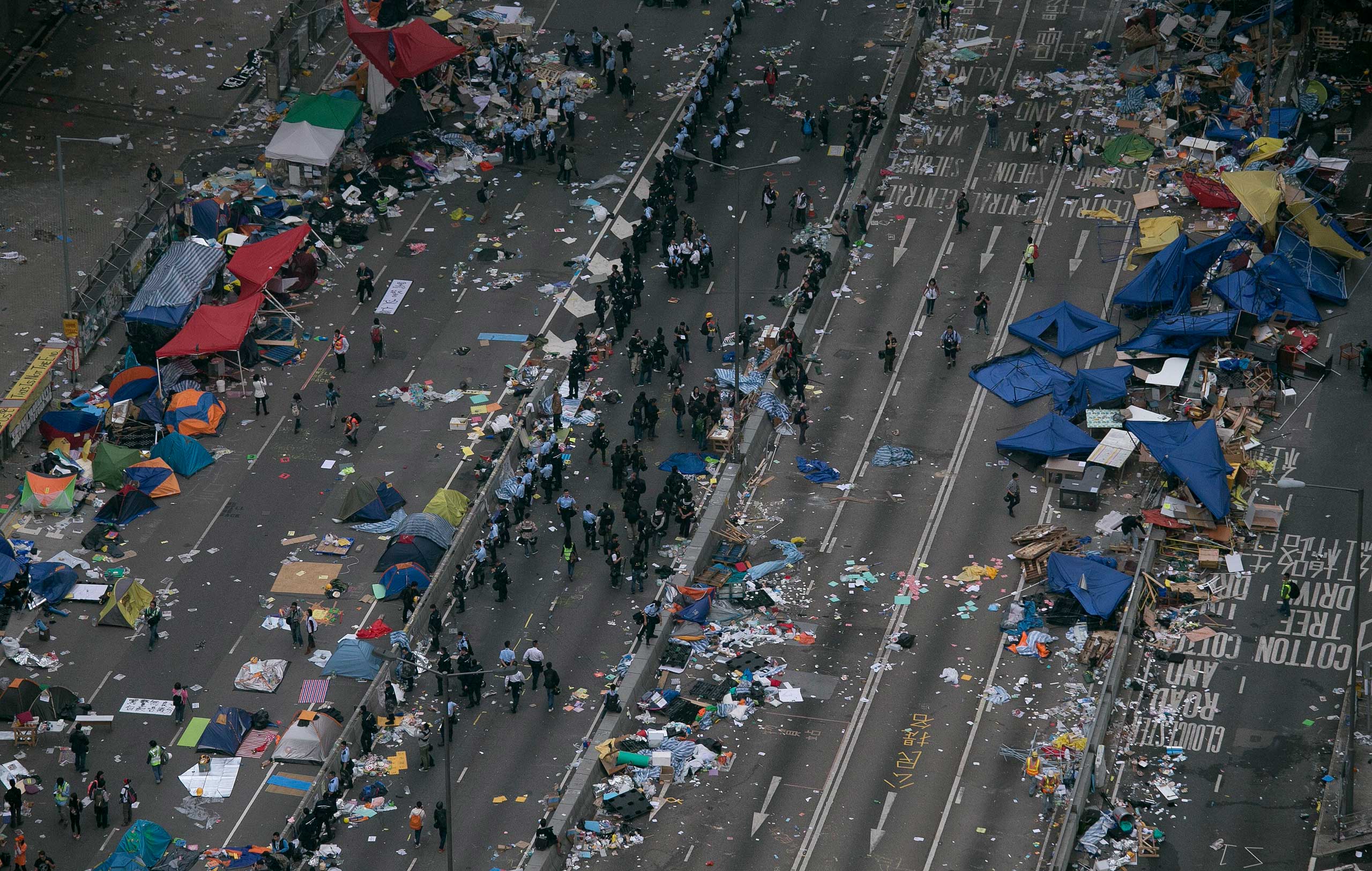 Dec. 11, 2014. A view of a main road after police cleared barricades and tents outside government headquarters in Hong Kong. Police took away demonstrators who refused to leave the main pro-democracy protest camp and tore down their tents in a final push to retake streets occupied by activists for two and a half months.