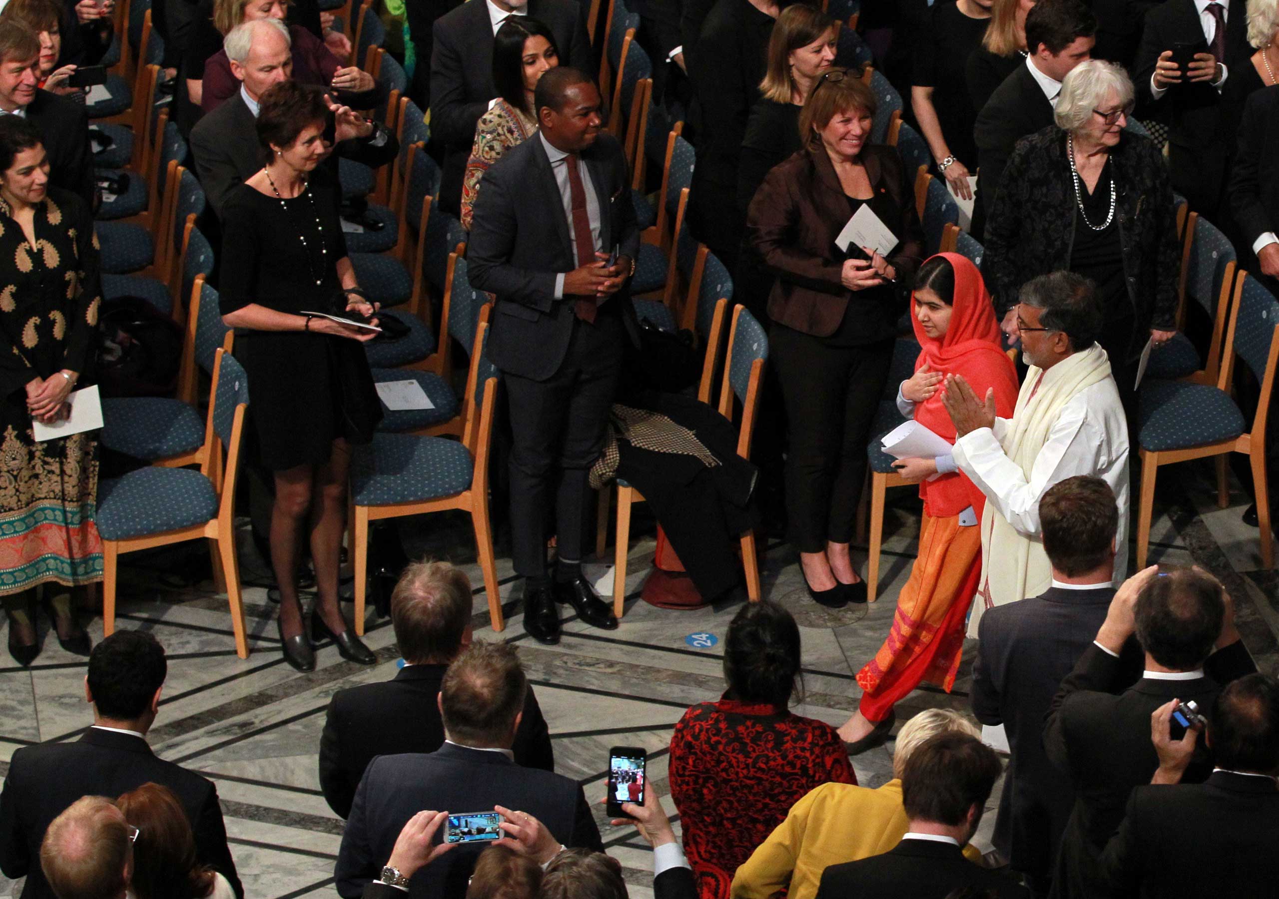 Dec. 10, 2014. Nobel Peace Prize laureates Malala Yousafzai, second right, and Kailash Satyarthi, right, arrive for the Nobel Peace Prize awards ceremony at the City Hall in Oslo. 17-year-old Malala shares the 2014 peace prize with the Indian campaigner Satyarthi, 60, who has fought for 35 years to free thousands of children from virtual slave labour.