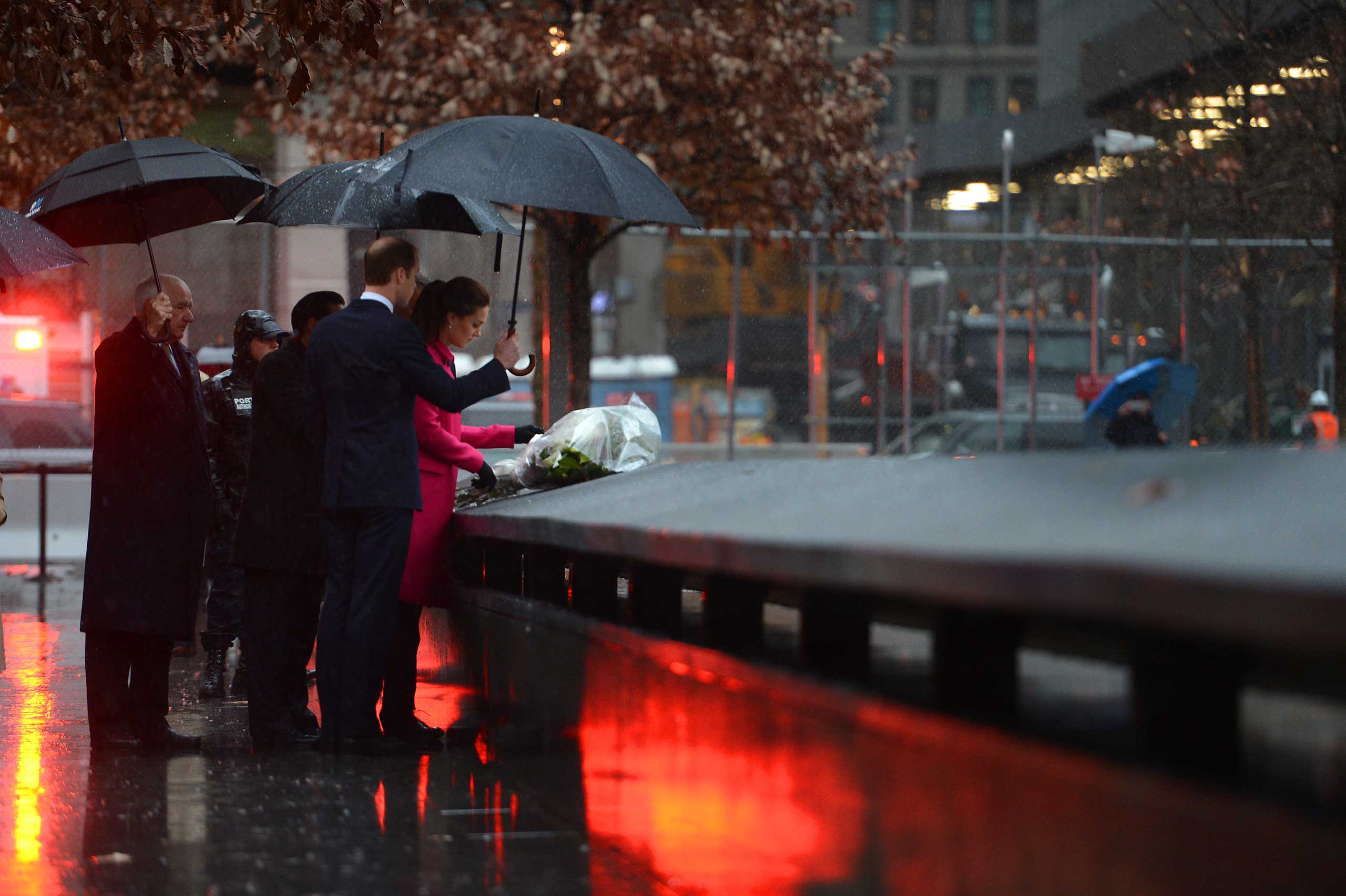 Dec. 09, 2014. The Duke and Duchess of Cambridge Prince William and Catherine lay flowers in memory of the victims of the 9/11 terrorist attacks during a visit to the National September 11 Memorial and Museum in New York City.  The royal couple, who is traveling without their son Prince George, is on a three-day U.S. east coast visit.