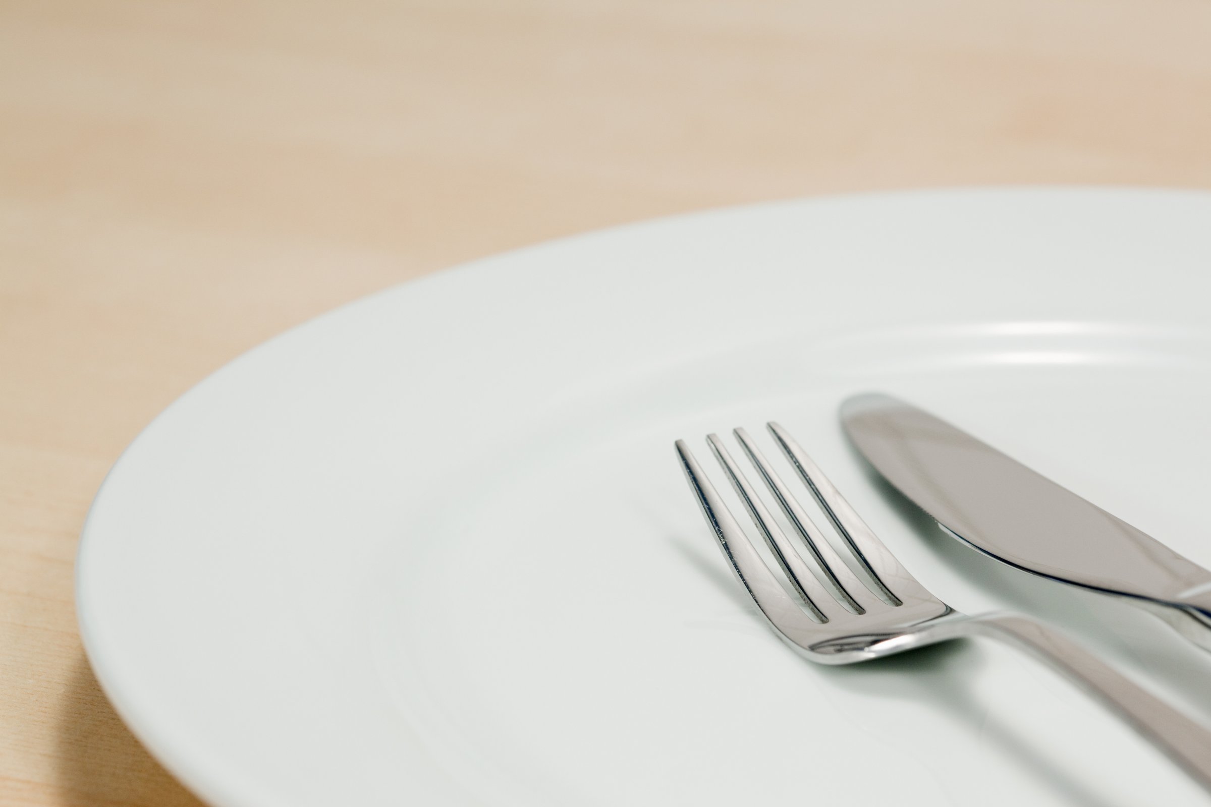 Empty plate with knife and fork