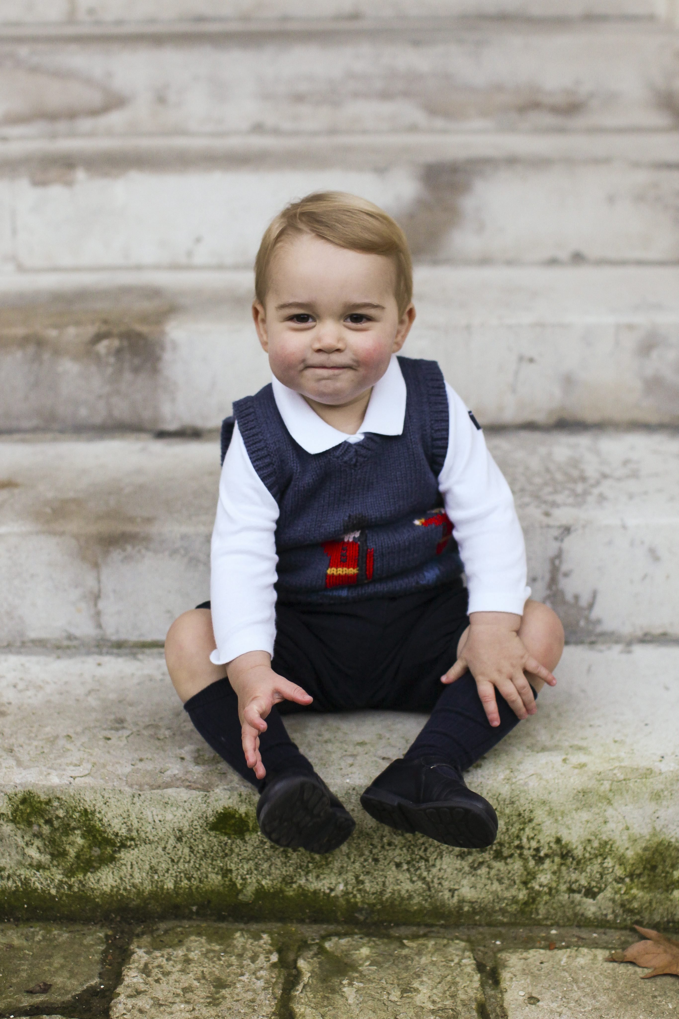 A Christmas photo of Prince George in a courtyard at Kensington Palace, London, released on Dec. 13, 2014. (The Duke and Duchess of Cambridge/EPA)