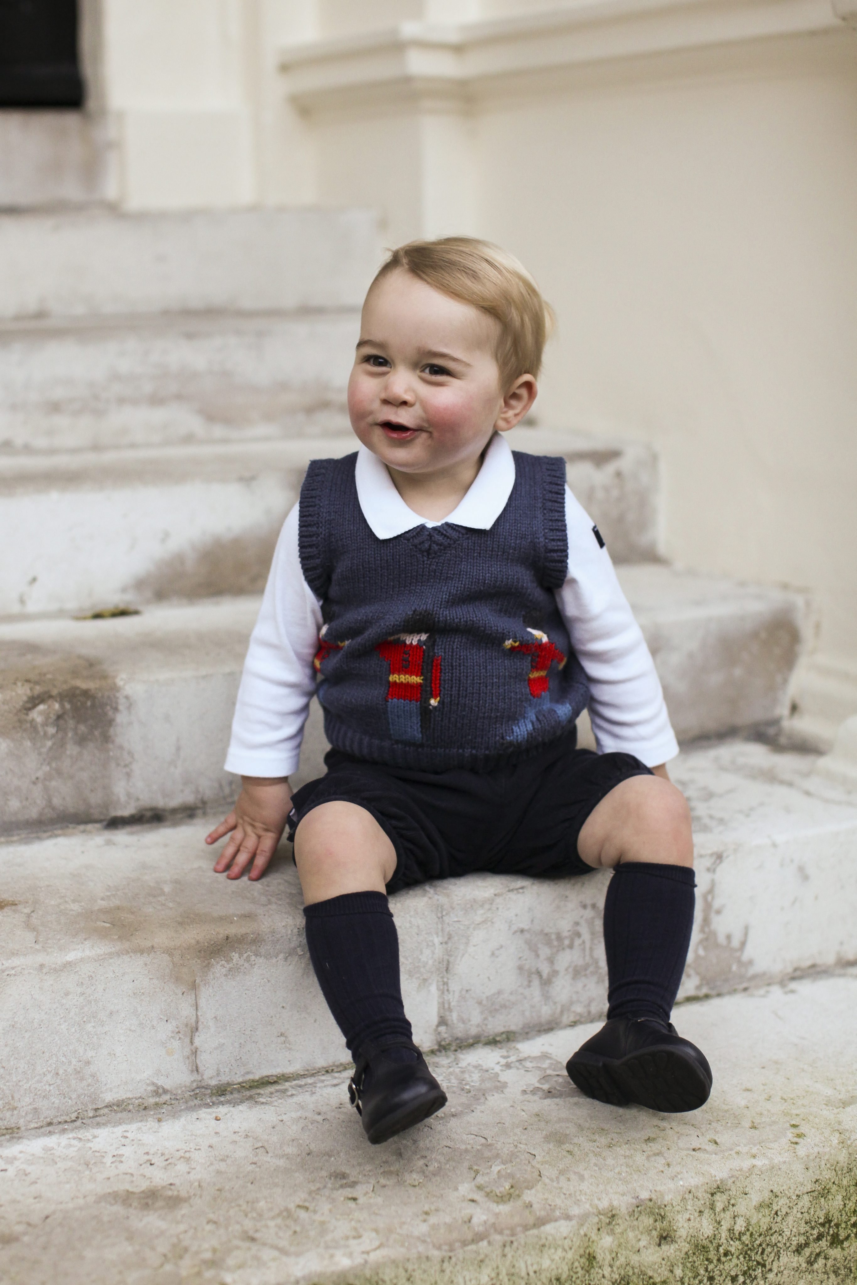 A Christmas photo of Prince George in a courtyard at Kensington Palace, London released on Dec. 13, 2014. (The Duke and Duchess of Cambridge/EPA)