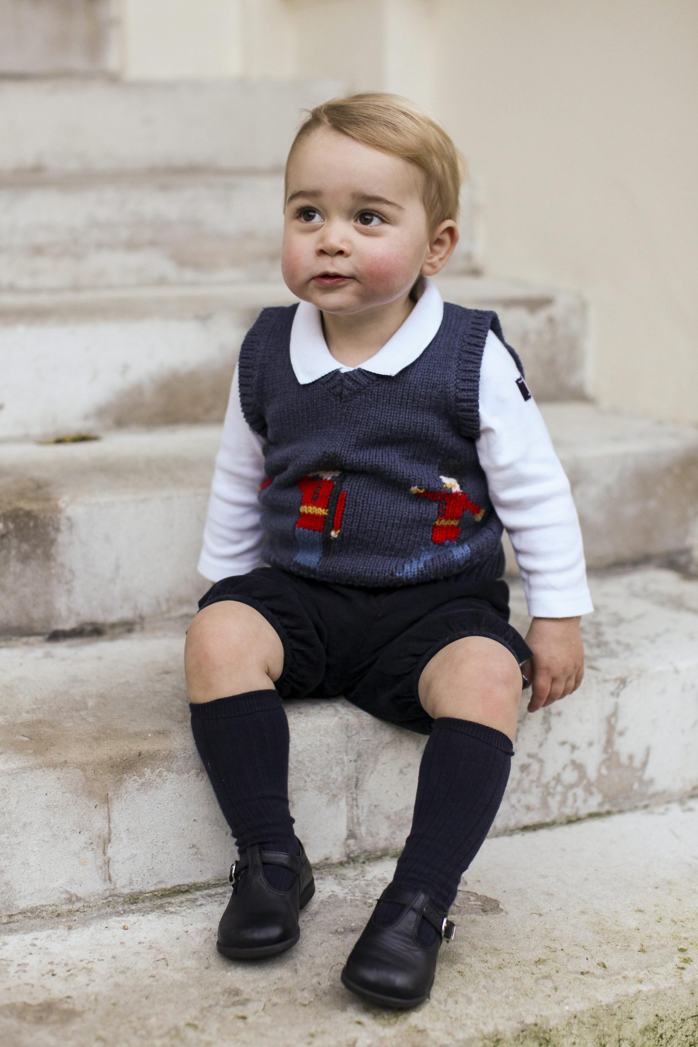 A Christmas photo of Prince George in a courtyard at Kensington Palace, London released on Dec. 13, 2014.
