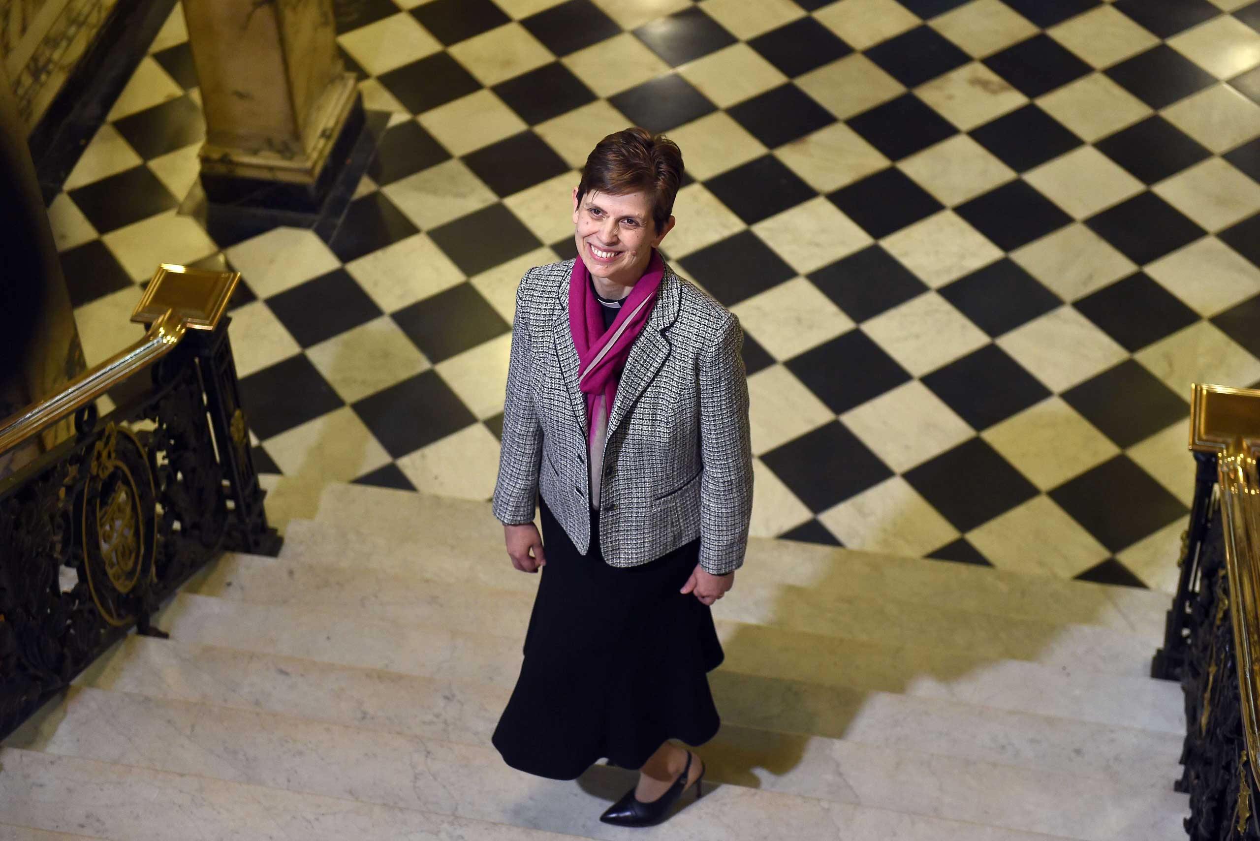Reverend Libby Lane poses for pictures during a photo call following the announcement naming her first woman bishop by The Church of England, after a historic change in its rules, in Stockport, northwest England, on Dec. 17, 2014. (Paul Ellis—AFP/Getty Images)