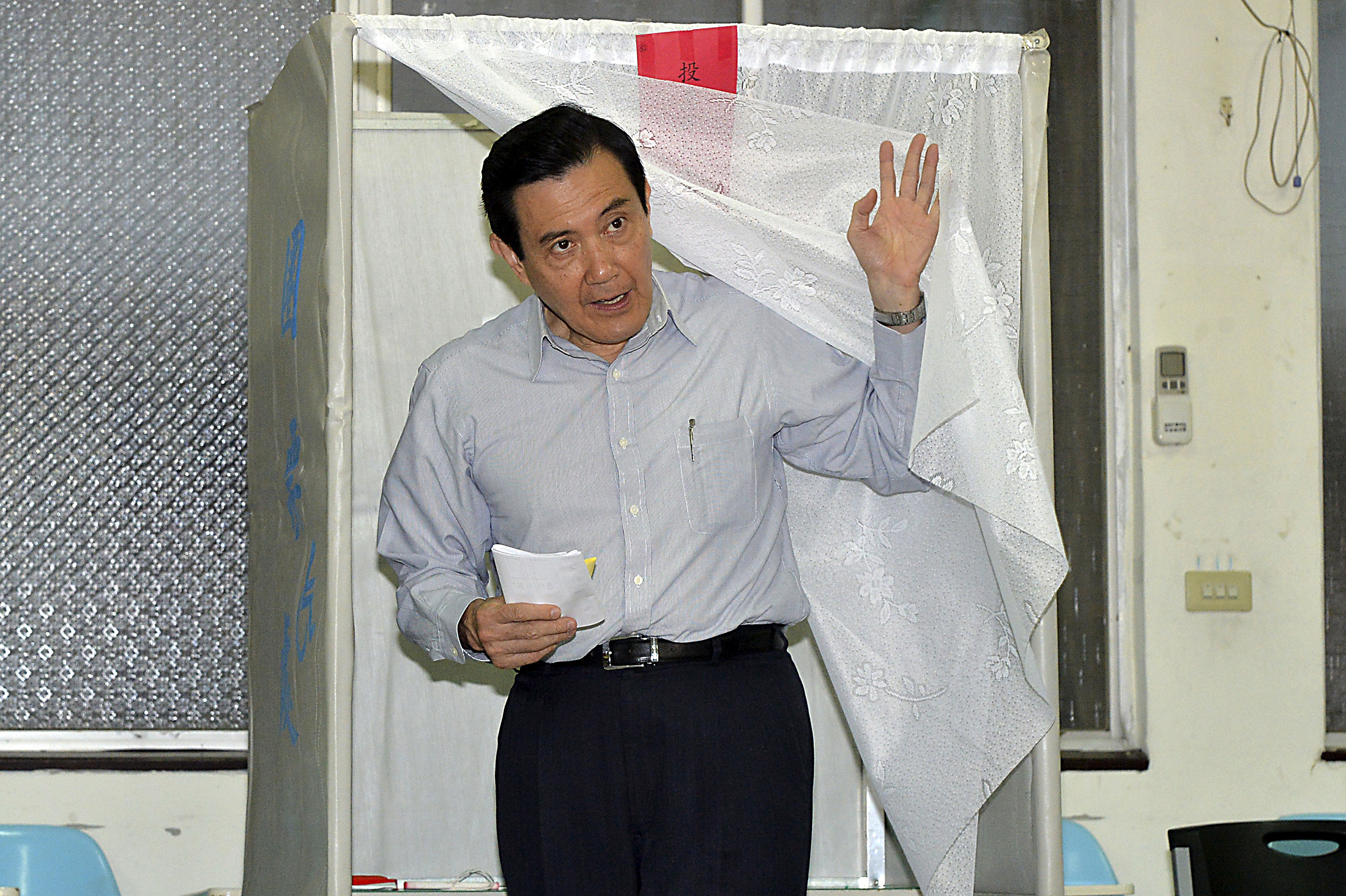 Taiwan's President Ma Ying-jeou walks out of a voting booth at a polling station in Taipei during local elections on Nov. 29, 2014 (Frank Sun—Reuters)
