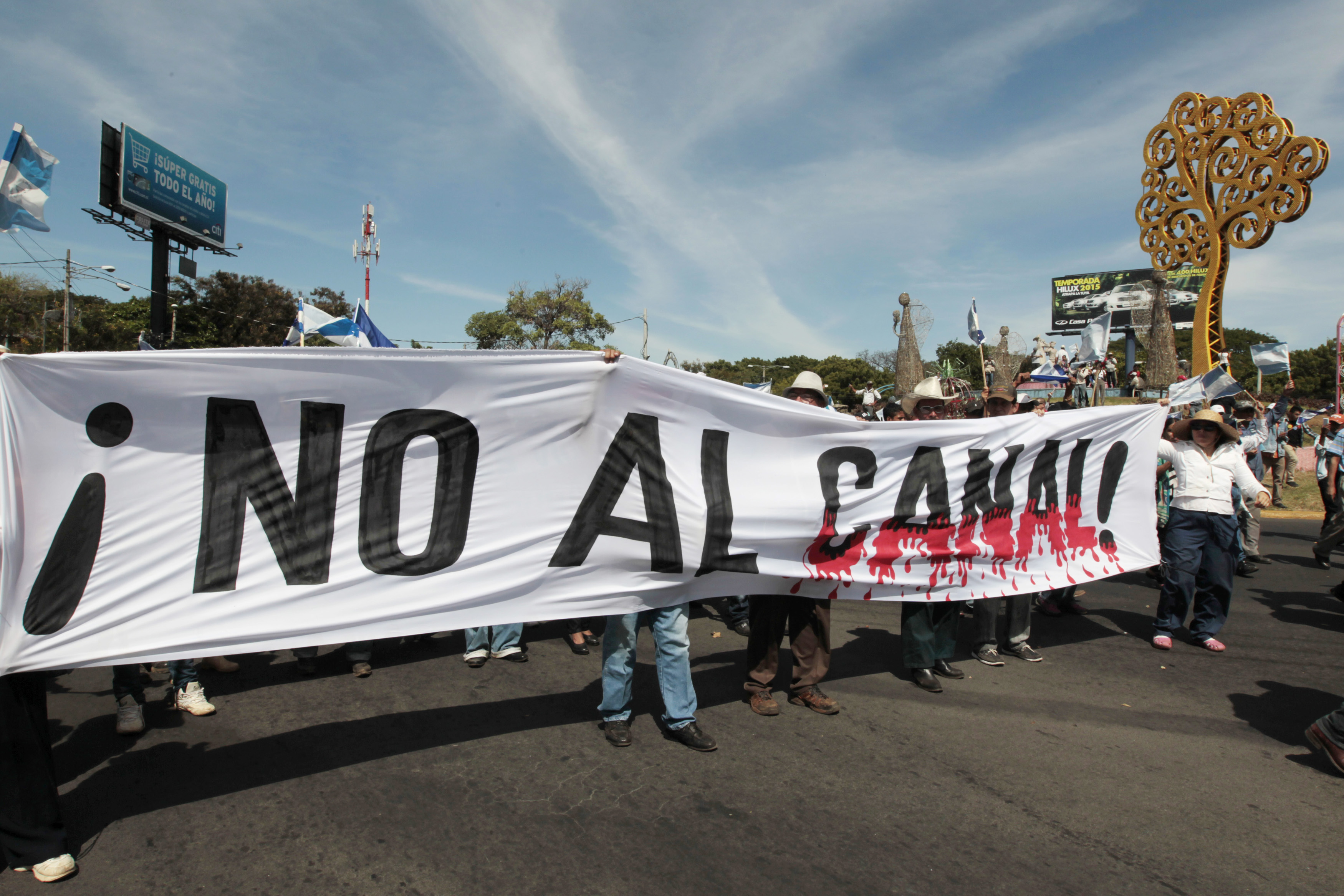 Demonstrators hold a banner during a march to protest against the construction of the Interoceanic Grand Canal on Dec. 10, 2014, in Managua, Nicaragua (Oswaldo Rivas—Reuters)