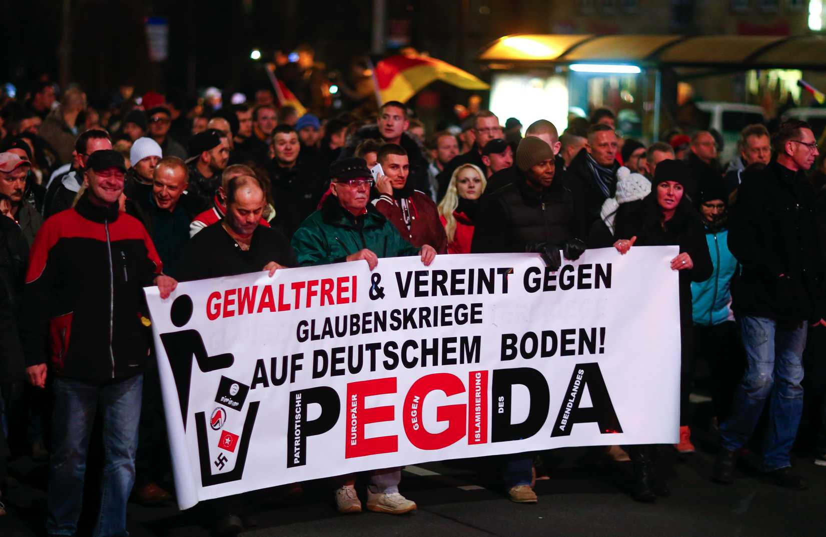 Participants hold a banner during a demonstration called by anti-immigration group Patriotic Europeans Against the Islamization of the West (Pegida) in Dresden, Germany, on Dec. 15, 2014 (Hannibal Hanschke—Reuters)